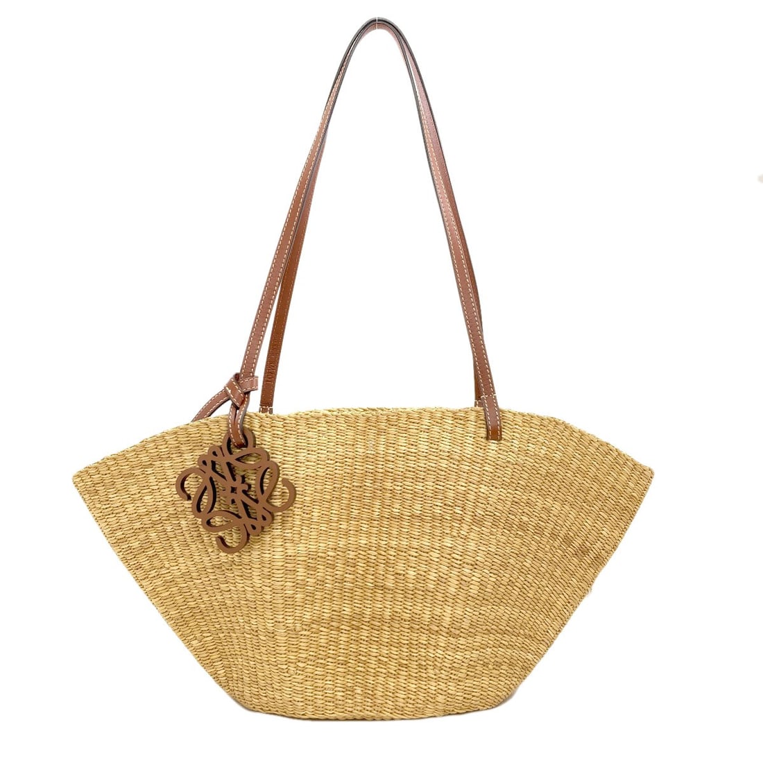 Shell Leather Straw Bag Tote Loewe Basket: Shell Leather Straw Bag Tote Loewe Basket Beige straw tote bag from LOEWE, featuring a classic design with a basket-like shape. The exterior is made from high-quality straw, giving it a natural and