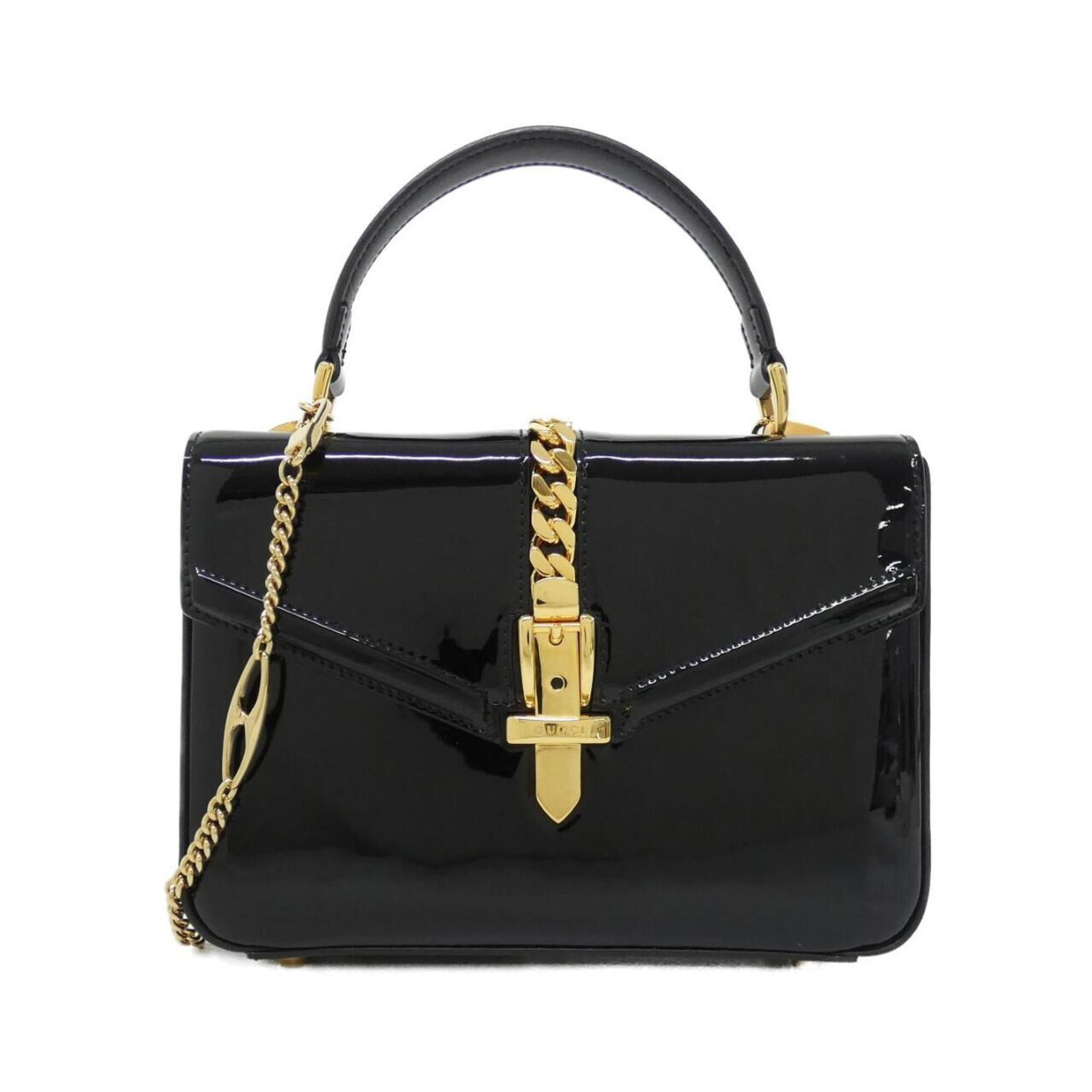 Handbag Leather Gucci: Handbag Leather Gucci Black leather Gucci handbag with a 15cm x 21cm x 5.5cm size, featuring enamel leather and a signature. This stylish accessory is made from high-quality leather and has a sleek,