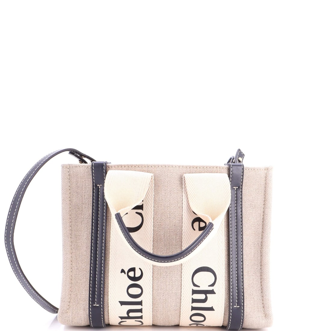 Woody Canvas Tote Small Leather Chloe: Woody Canvas Tote Small Leather Chloe Small Leather Chloe Woody Canvas Tote with Gold Tone Hardware, featuring a neutral blue exterior, gold tone accents, and a sturdy canvas interior. The tote