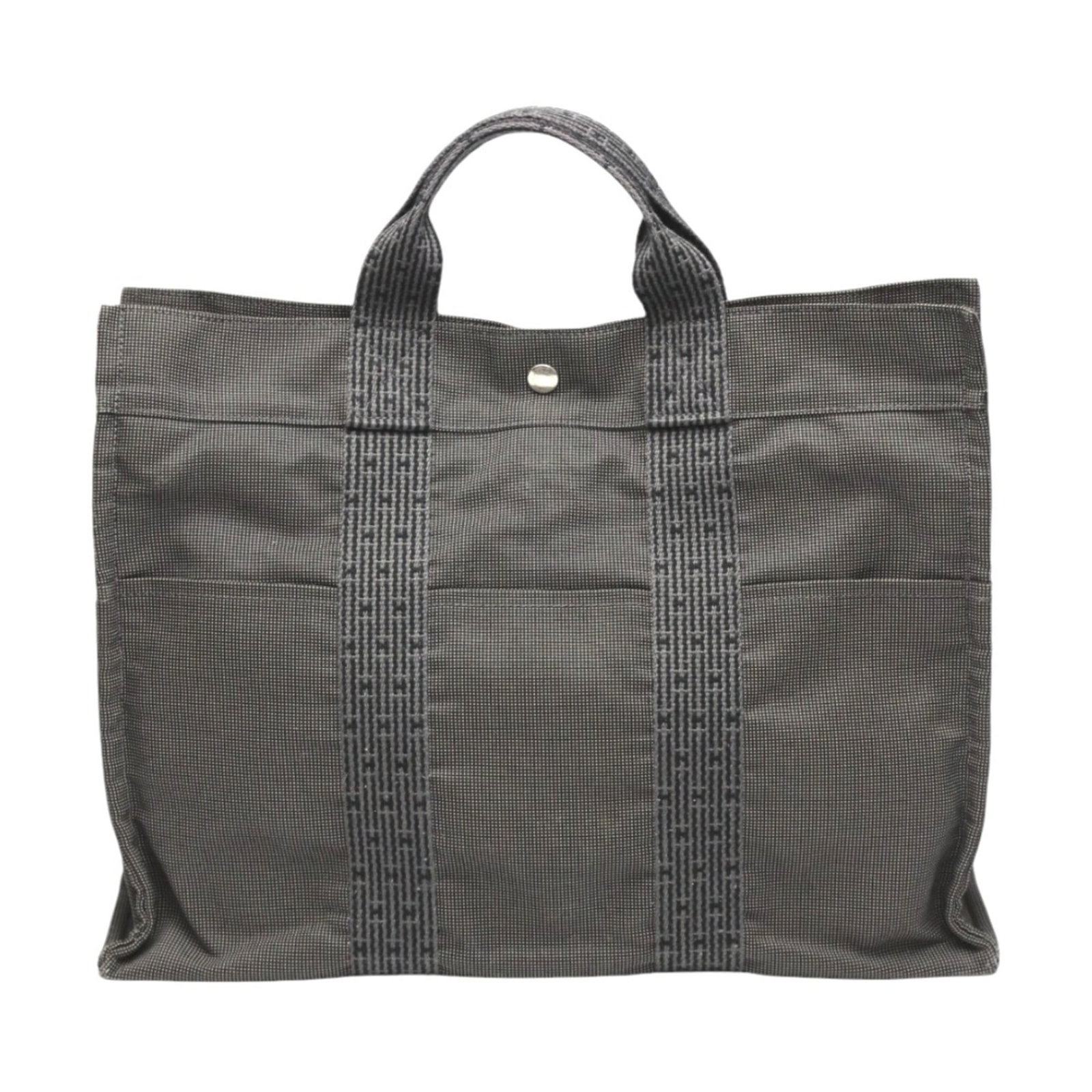 Canvas tote bag Hermes: Canvas tote bag Hermes Canvas tote bag from Hermes Line, made from high-quality canvas material in a versatile gray color, featuring a size of 31cm x 41cm x 11cm. The bag's handle drop is 10cm, making