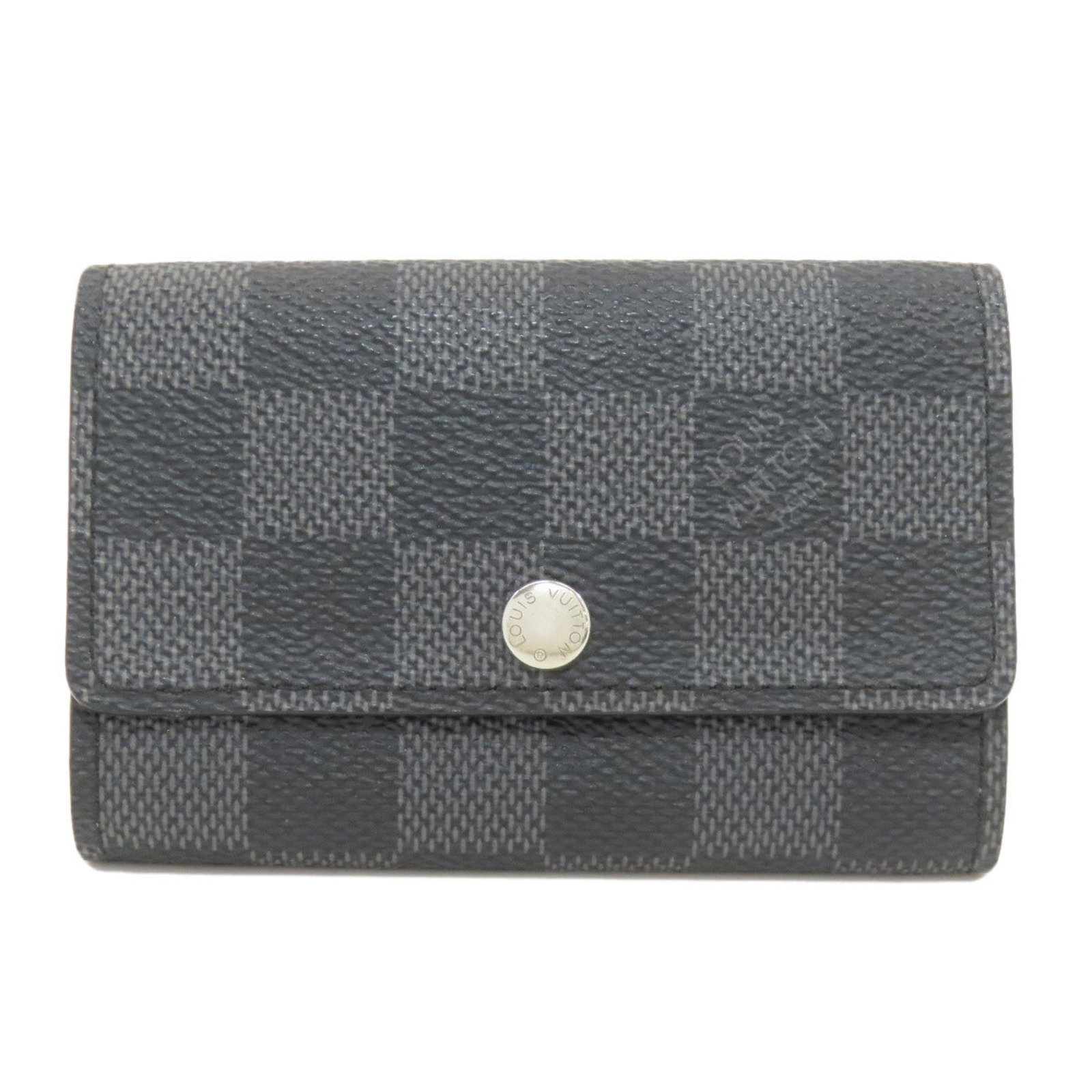Keycase Damier Canvas Louis Vuitton: Keycase Damier Canvas Louis Vuitton Damier Canvas Louis Vuitton Keycase in Graphite and Dark Gray. This compact keycase features the iconic Damier Graphite and Dark Gray pattern, crafted from