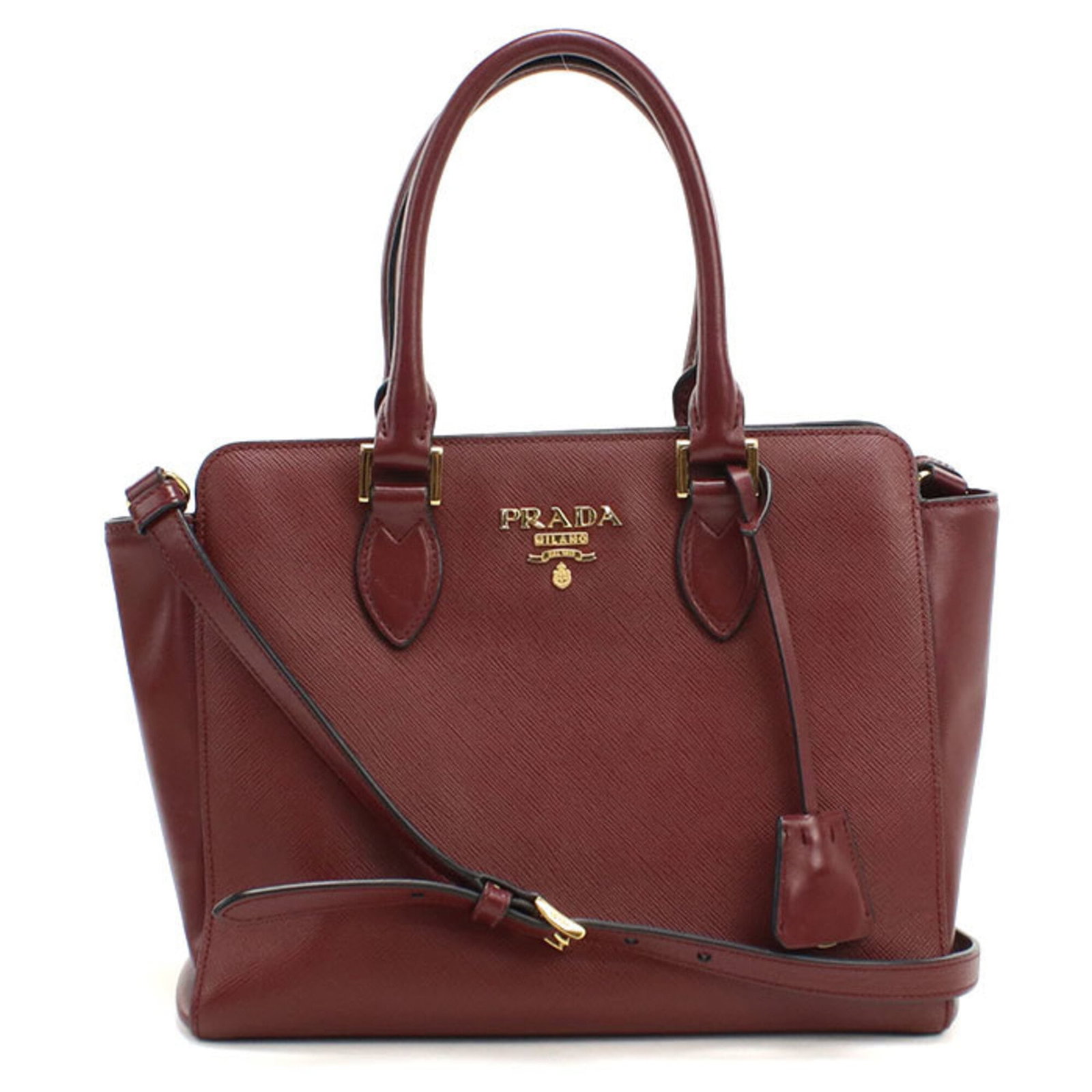 Leather Prada Tote Bag: Leather Prada Tote Bag Saffiano leather Red color, Wine gold hardware, and a classic design make this Prada tote bag a stylish and sophisticated accessory. Measuring 21cm x 26cm x 11cm, it features th