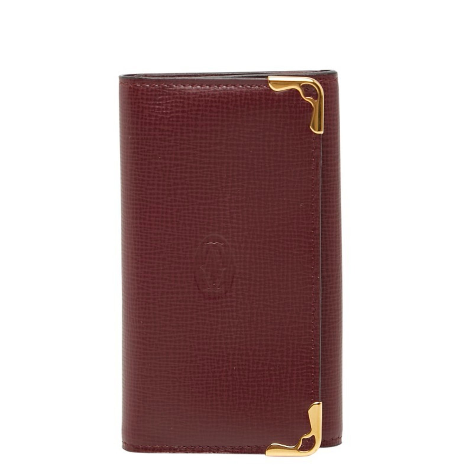 Keycase Leather: Keycase Leather Wine red leather wraps around a sleek keycase, measuring 10cm x 6cm x 2cm. This Cartier keycase is crafted from high-quality leather, providing a sophisticated and elegant accessory. T