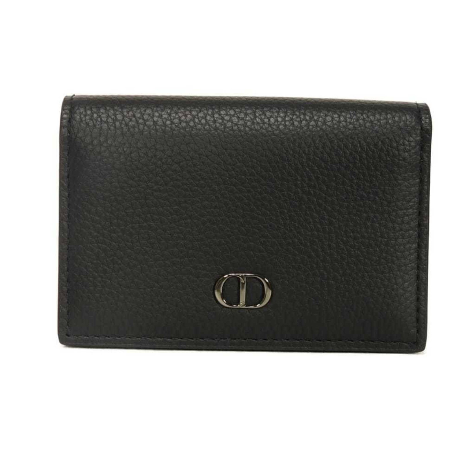 Card Case Leather By Dior: Card Case Leather By Dior Card Case Leather By Dior is made of high-quality black leather, measuring 7.3cm x 10cm x 2.5cm. This stylish card case is designed with a sleek and modern aesthetic, making