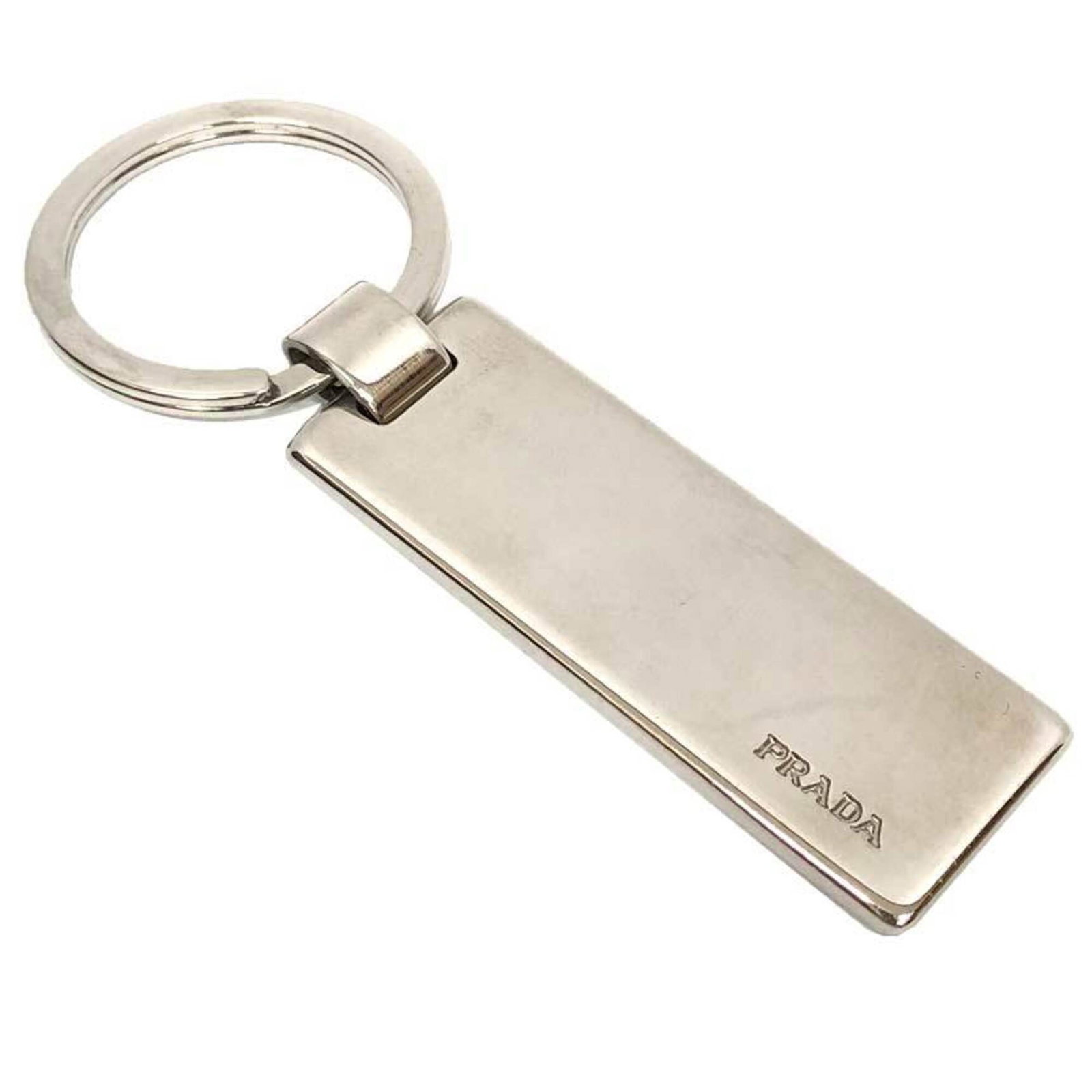 Keyring Metal Prada: Keyring Metal Prada Silver metal keyring from Prada, a renowned Italian luxury fashion brand. This sleek and sophisticated accessory is crafted from high-quality metal, adding a touch of elegance to a