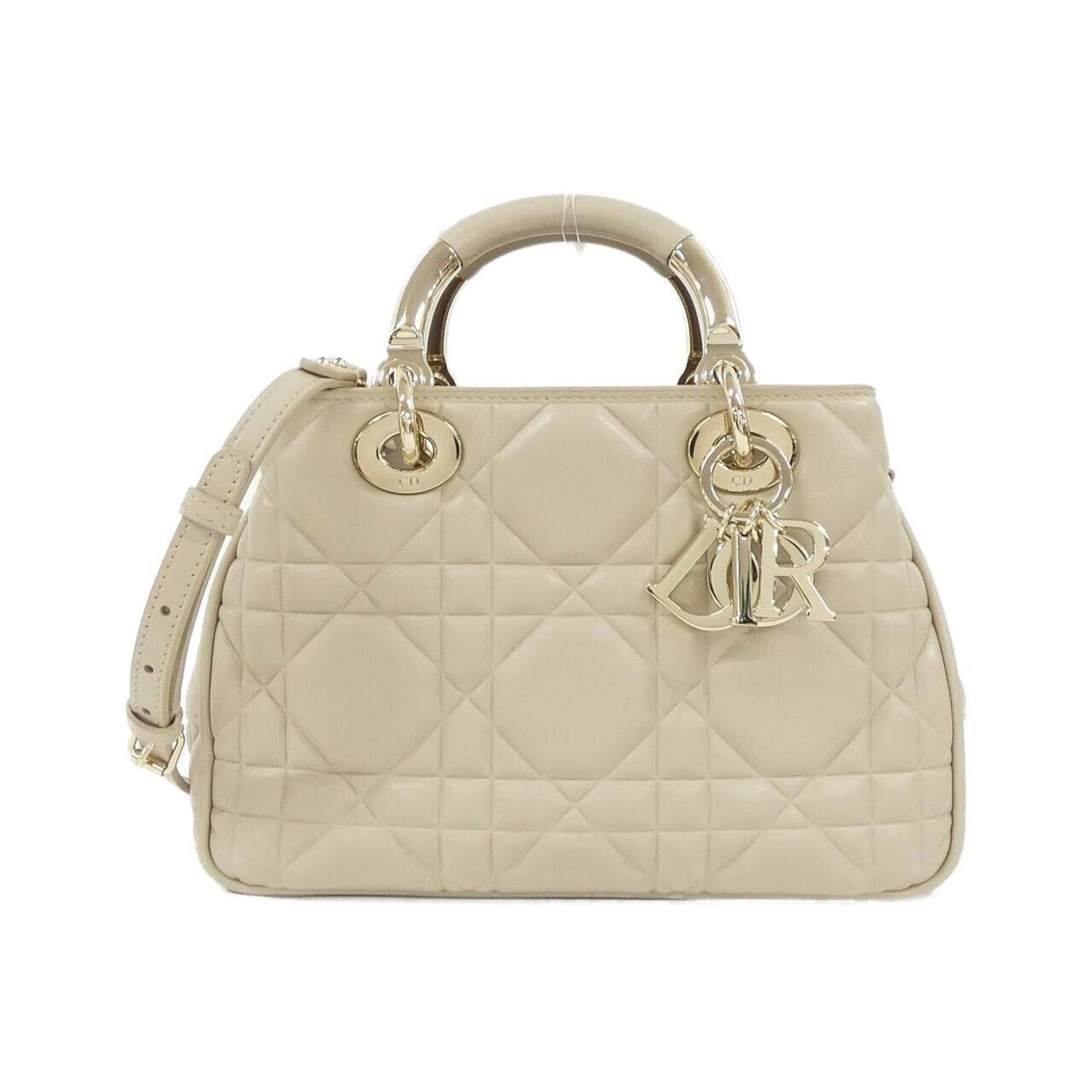 Handbag Leather Dior Christian: Handbag Leather Dior Christian This exquisite Handbag Leather Dior Christian features a stunning Beige color and is crafted from high-quality Calfskin leather. Measuring 17cm x 25cm x 10cm, it boasts