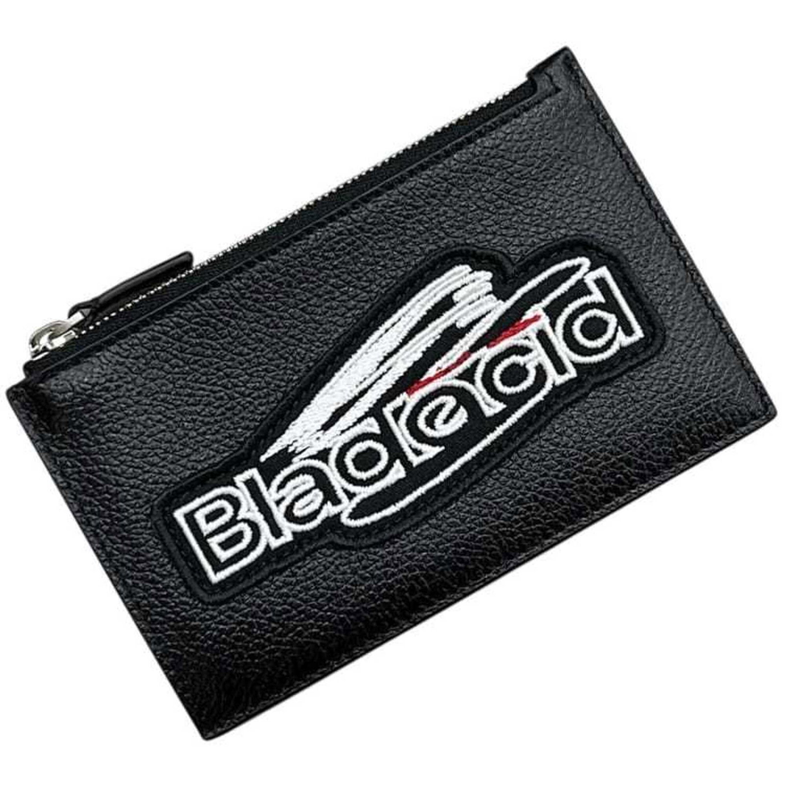 Balenciaga Coin Purse/ Coin Case Leather: Balenciaga Coin Purse/ Coin Case Leather The Balenciaga Coin Purse/ Coin Case Leather is a sleek and modern accessory made from high-quality black leather. Measuring 8.5cm x 13cm x 1cm, it features a