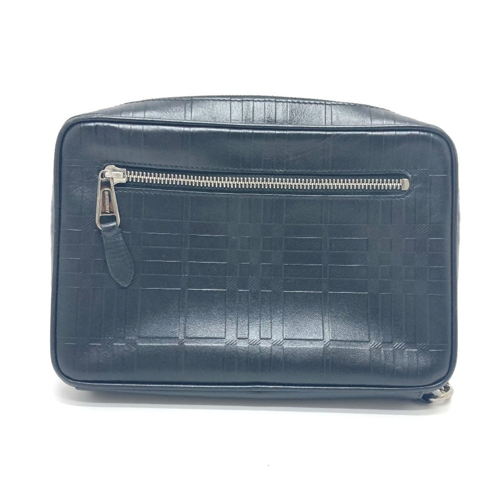 Bag Clutch Leather Burberry: Bag Clutch Leather Burberry Black leather clutch from Burberry, featuring a silver hardware and a hand strap for added convenience. This compact bag measures 15.5cm x 23cm x 5.5cm and is made from