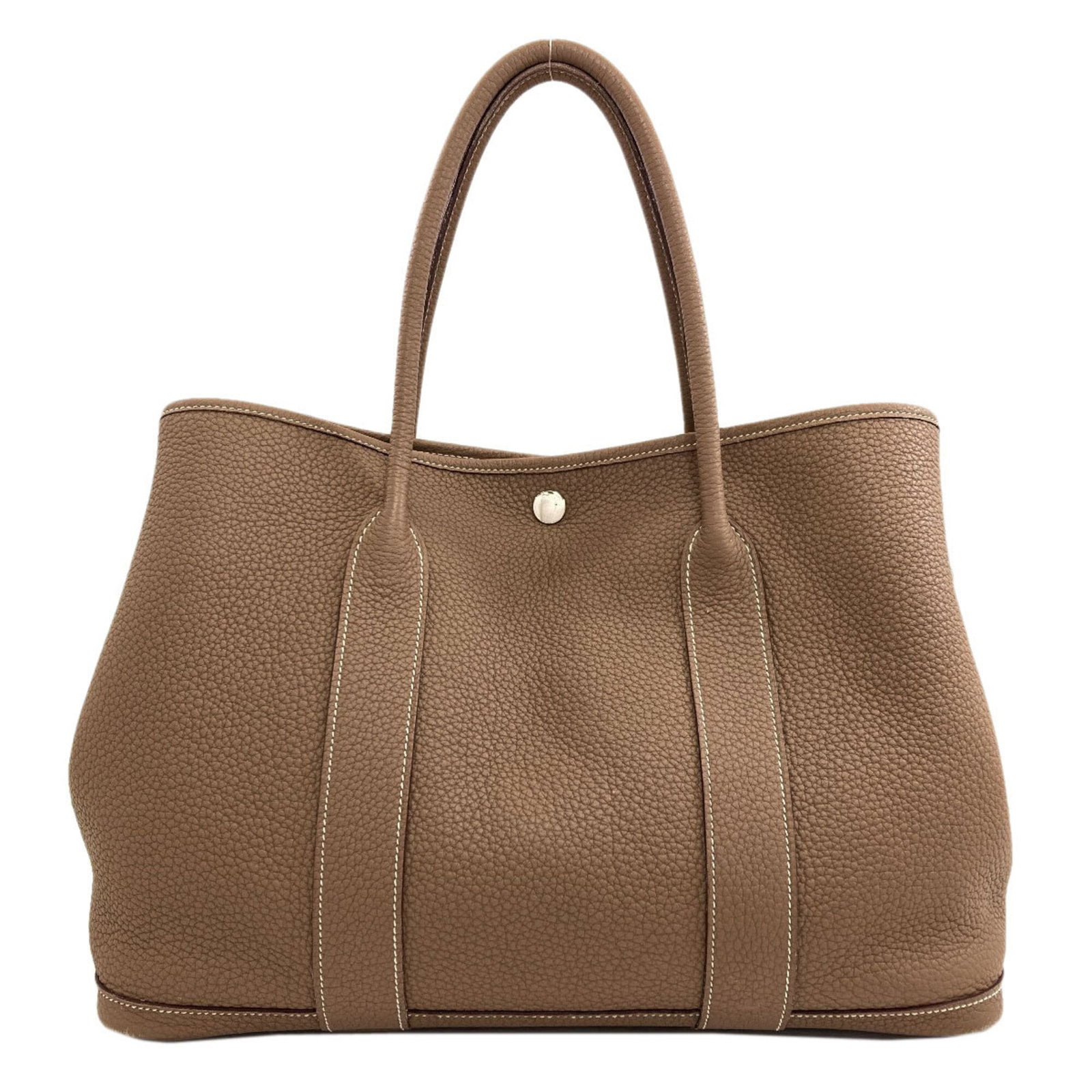 Hermes Negonda Leather Tote Bag: Hermes Negonda Leather Tote Bag Negonda leather tote bag from the Hermes line, featuring a classic design with a timeless etoupe gray color. Measuring 26cm x 36cm x 18cm, this bag is made from