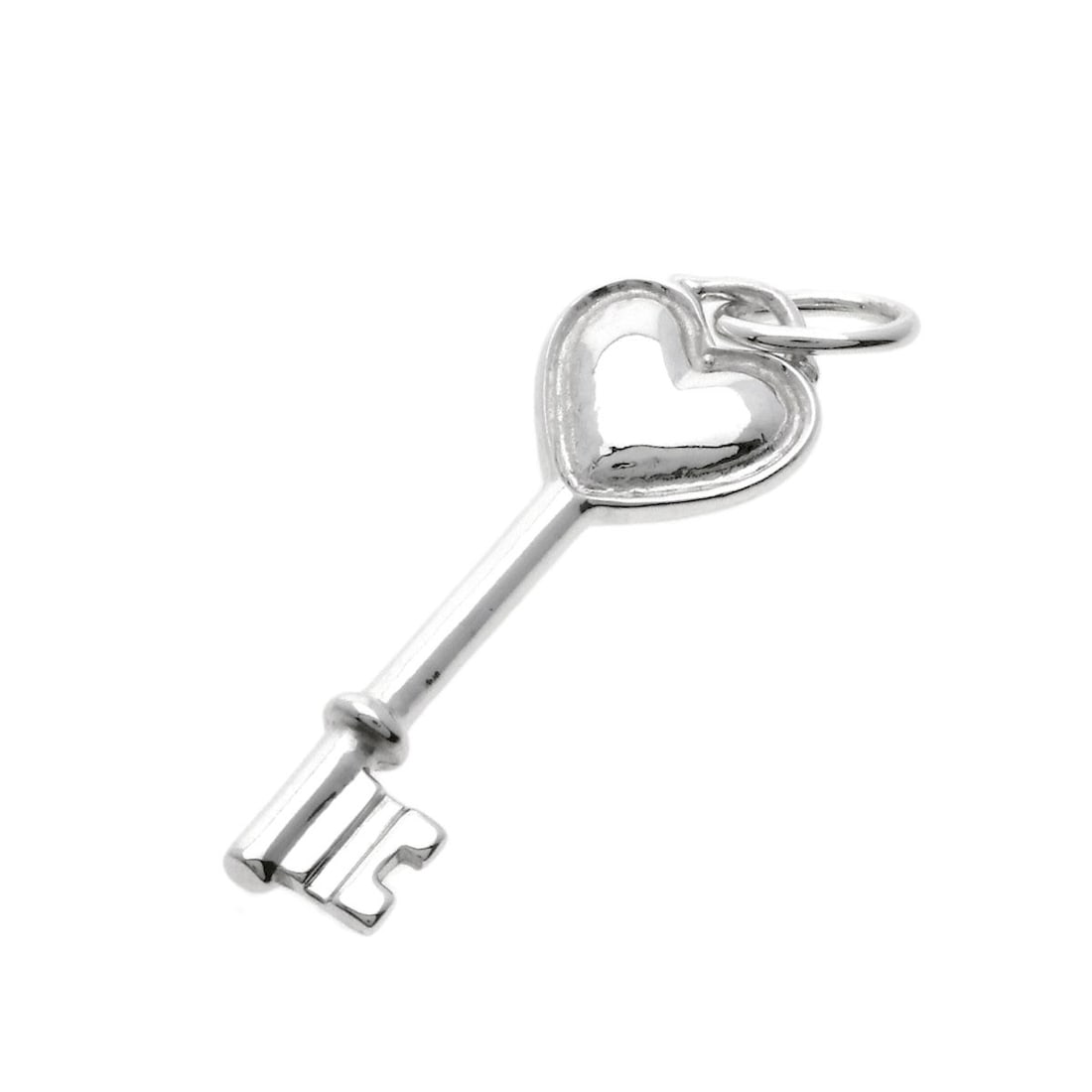 Key Pendant Tiffany&Co. Top Silver Heart: Key Pendant Tiffany&Co. Top Silver Heart Silver Tiffany&Co. Top Pendant Heart is a sterling silver pendant featuring a top design. This Tiffany&Co. pendant showcases a silver heart shape, a hallmark