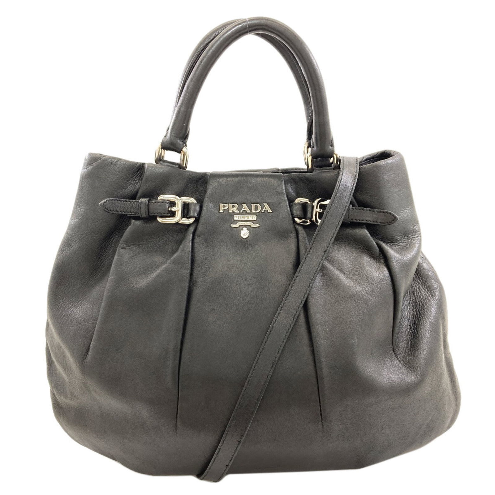 Handbag Leather Prada: Handbag Leather Prada Black leather Prada handbag with dimensions 31.5cm x 38cm x 2cm. This handbag features a classic design with a sleek black leather exterior. The signature is present on the