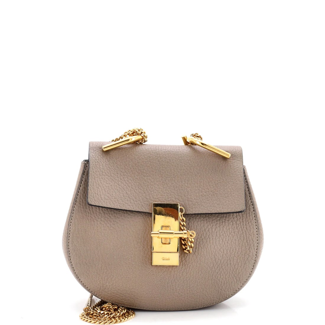 Drew Crossbody Bag Leather Chloe Mini: Drew Crossbody Bag Leather Chloe Mini The Drew Crossbody Bag Leather Chloe Mini is a neutral-toned, leather mini bag with a gold hardware and suede interior. Measuring 7" x 7.5" x 3", it features a