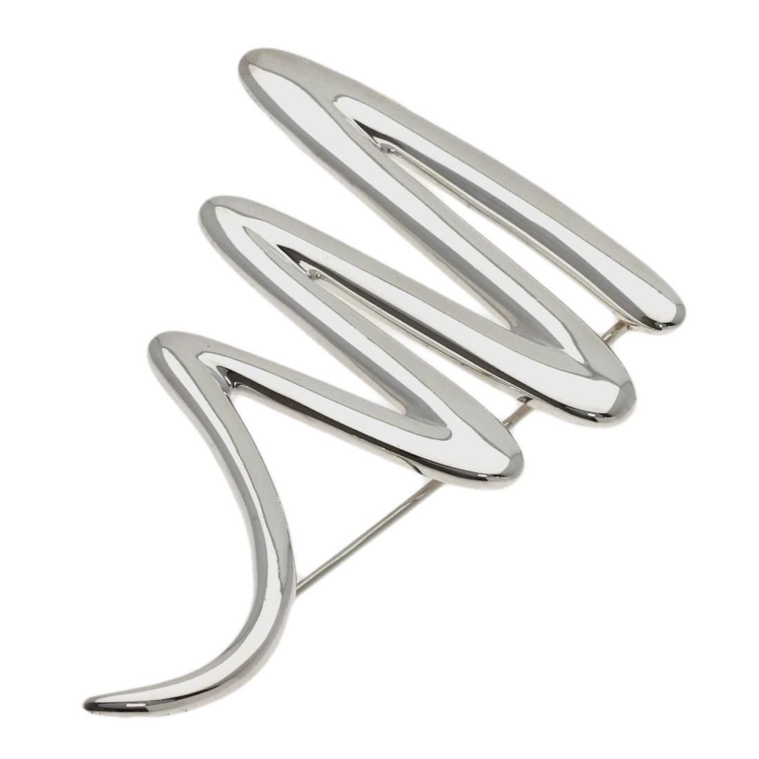 Tiffany Co Scribble Silver Brooch: Tiffany Co Scribble Silver Brooch Silver Scribble Brooch by Tiffany & Co. features a striking silver design. The brooch bears a signature, adding a touch of elegance to any outfit. Its sleek silver ex