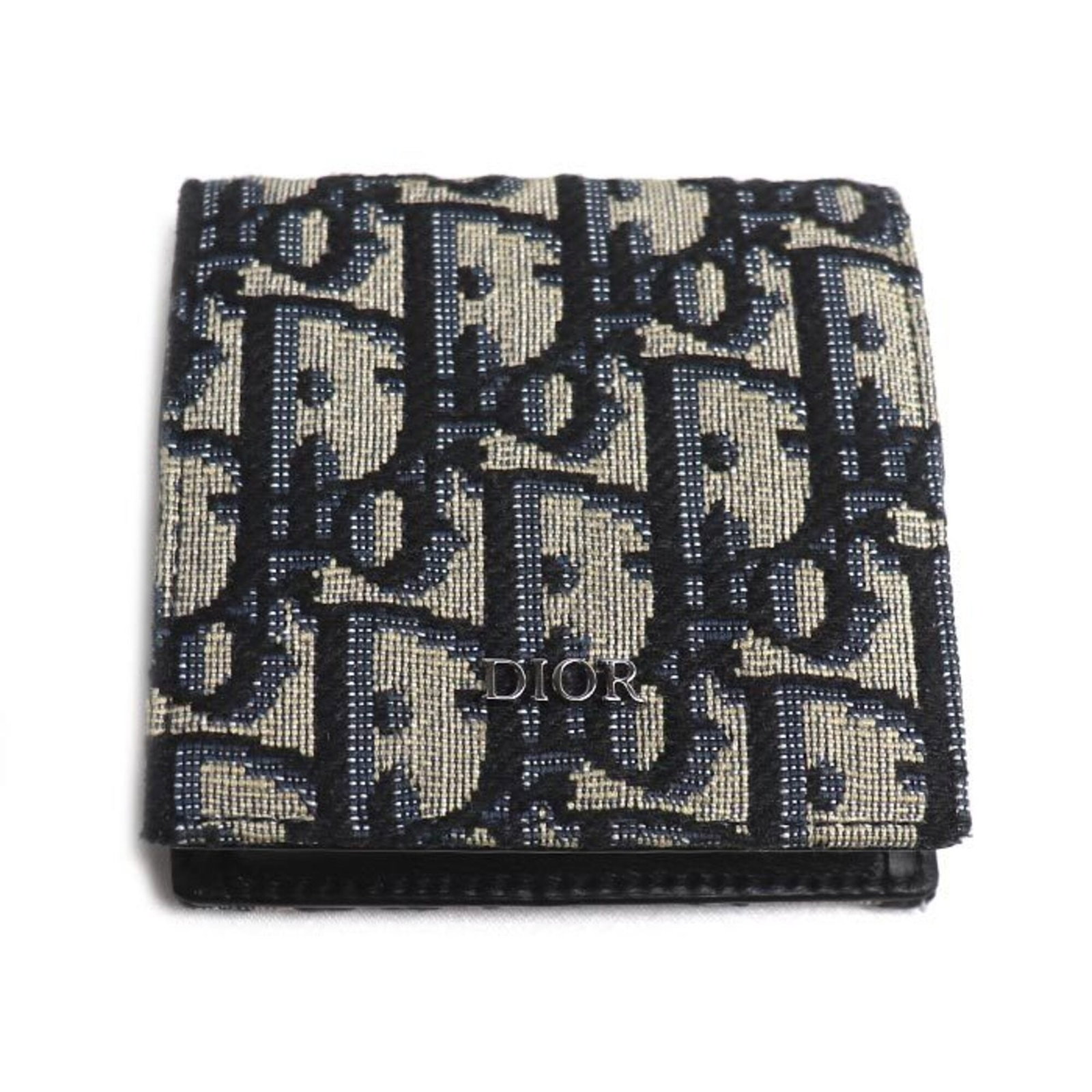 Christian Dior Coin Purse/ Coin Case Jacquard: Christian Dior Coin Purse/ Coin Case Jacquard The Christian Dior Coin Purse/ Coin Case Jacquard is a stylish and elegant accessory from the renowned French fashion house. Made from high-quality