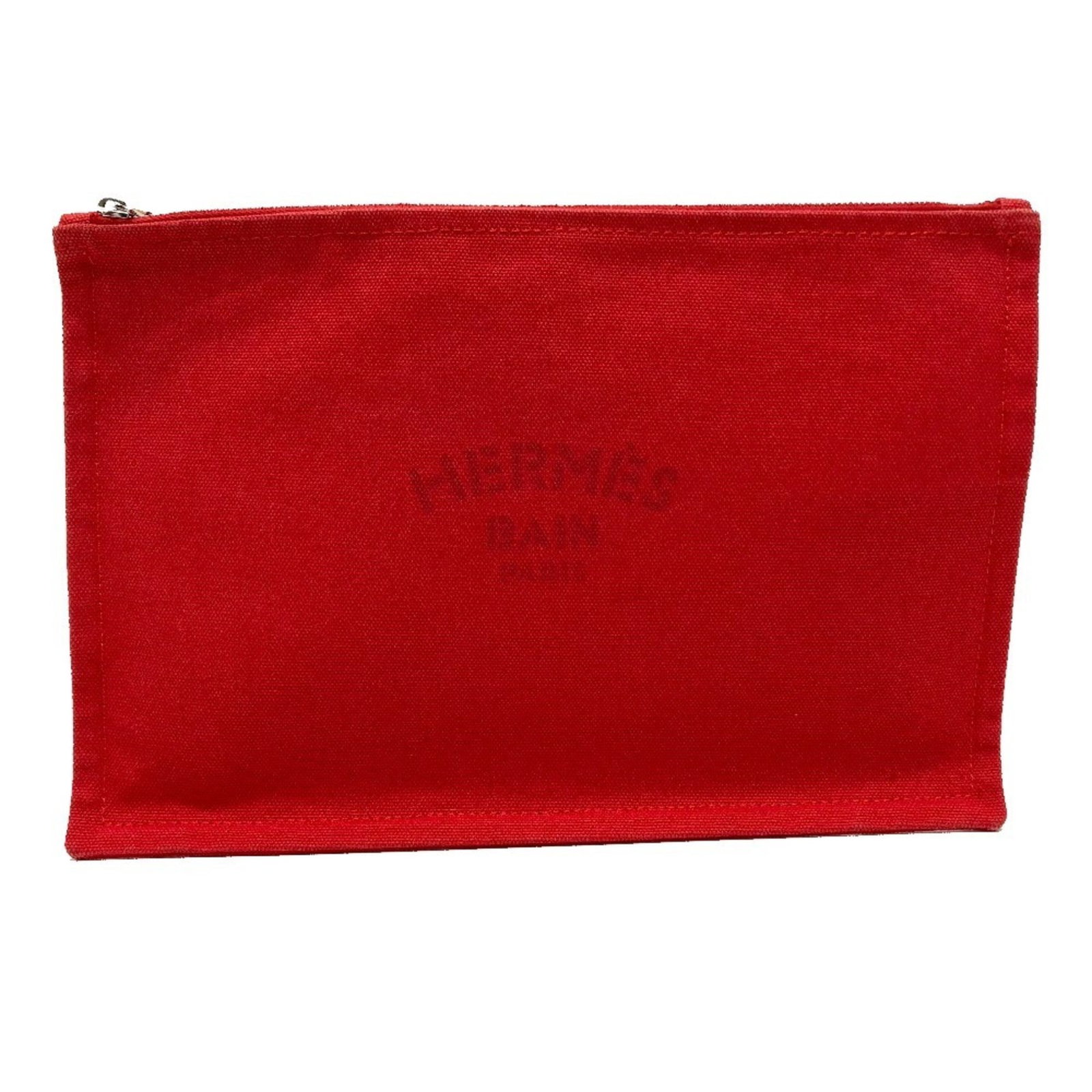 Cotton Pouch Hermes: Cotton Pouch Hermes Cotton Pouch from the iconic brand Hermes, featuring a striking red color and a functional zipper closure. Measuring 18cm x 28cm x 3.00mm, this pouch is a compact and practical