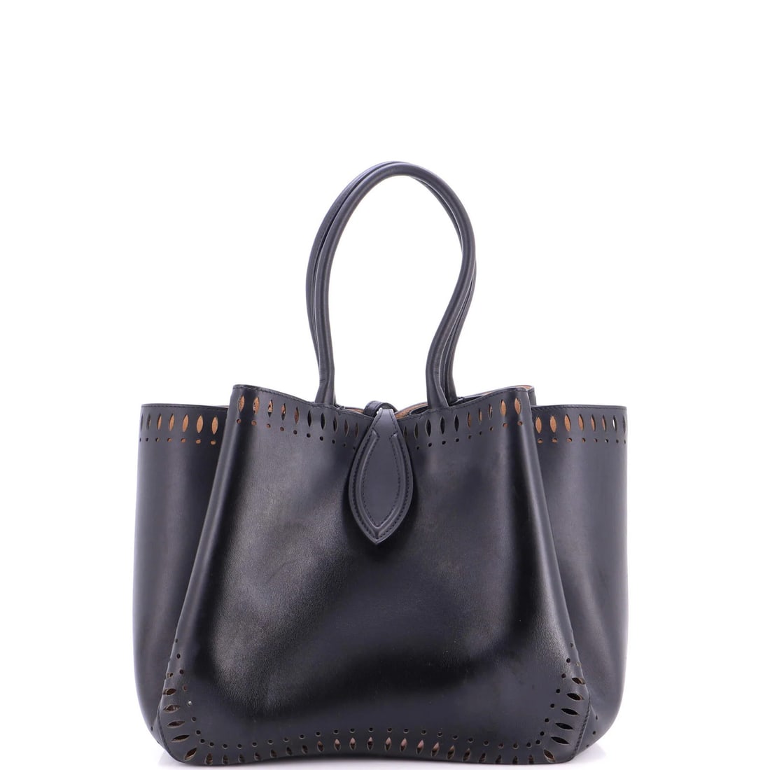Tote Leather Laser Cut Alaia Angele 25: Tote Leather Laser Cut Alaia Angele 25 Tote Leather Laser Cut Alaia Angele 25 features a striking black exterior with a sophisticated laser cut design. The interior boasts a luxurious suede interior
