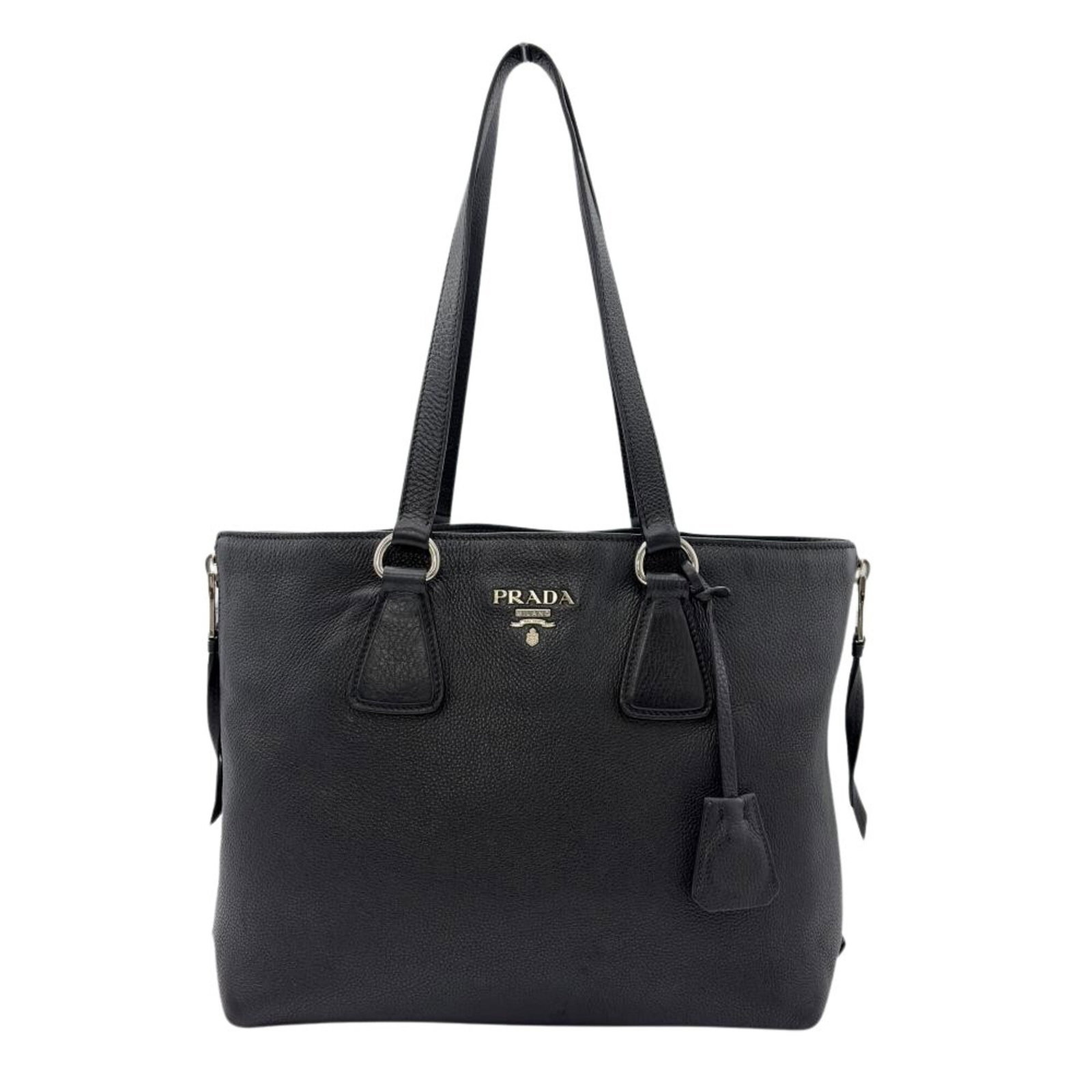 Leather Prada Tote Bag: Leather Prada Tote Bag Black leather tote bag from Prada, measuring 25cm x 30.5cm x 13cm. Made from high-quality leather, this bag features silver hardware and a classic design. A timeless and sophist