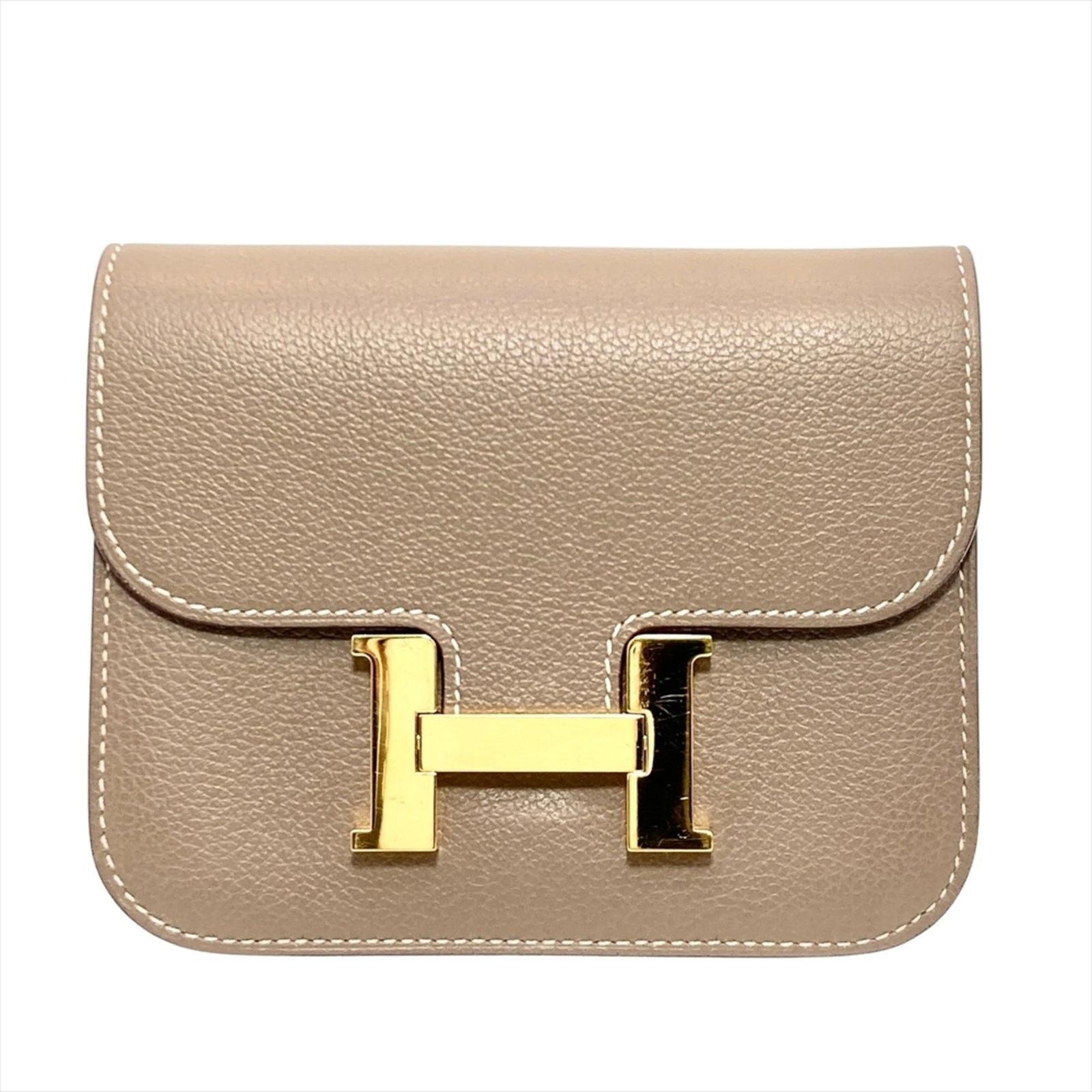 Bi-fold Wallet by Hermes: Bi-fold Wallet by Hermes Etoupe gray, a sophisticated and understated color, is showcased in this bi-fold wallet by Hermes, crafted with precision and attention to detail. Measuring 10cm x 12.5cm x
