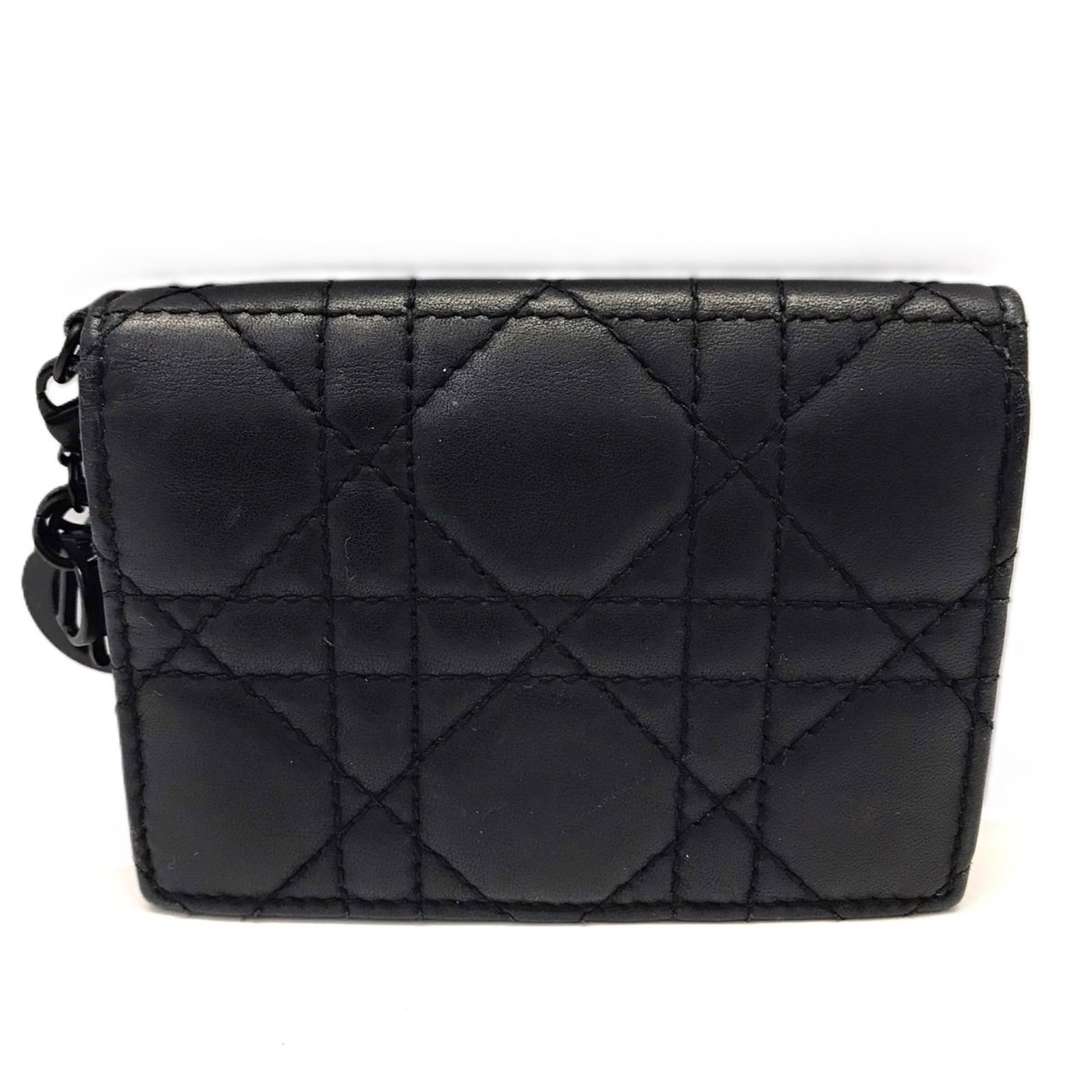 Card Case Leather By Dior: Card Case Leather By Dior Black Card Case by Dior features high-quality calfskin leather construction. The sleek design and compact size make it a practical accessory for daily use. Comes with