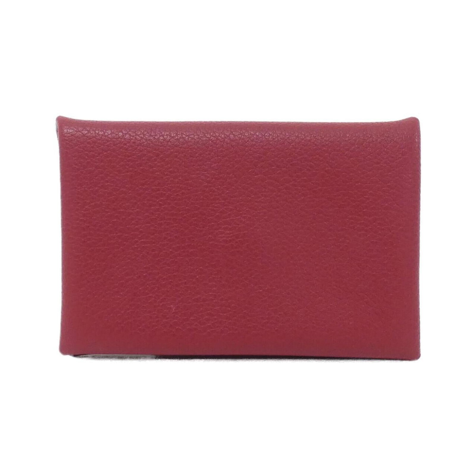 Card case Hermes: Card case Hermes The Card case Hermes features a vibrant Rouge Grenat color, adding a pop of color to any wallet or card collection. Measuring 7cm x 10.5cm x 1.5cm, this compact case is designed to
