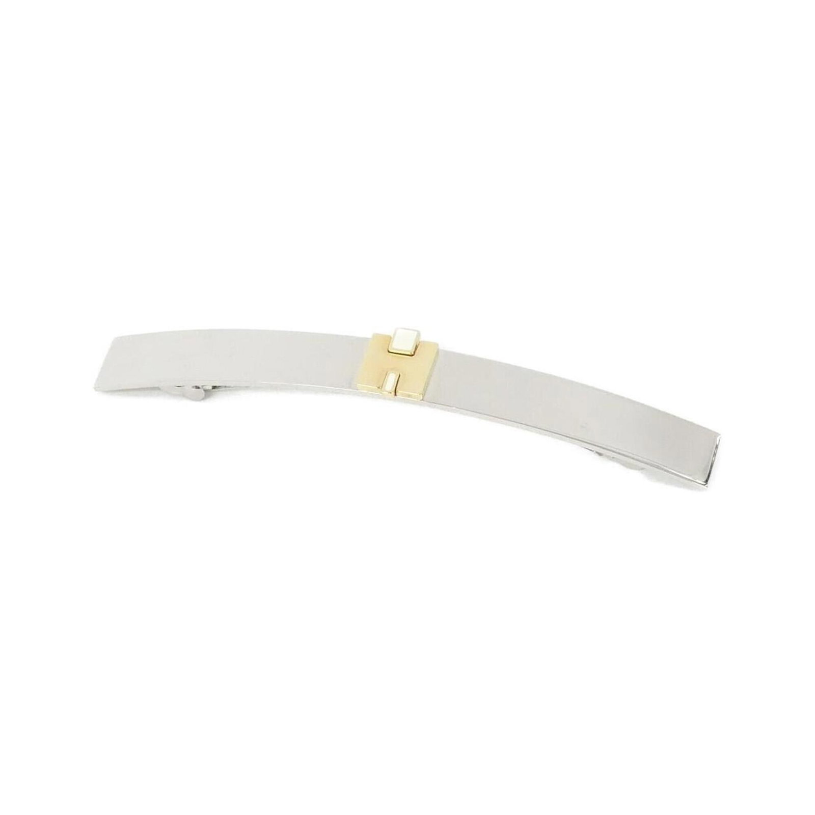Hermes Barrette: Hermes Barrette Gold and white Hermes barrette, measuring 1cm x 11cm, bears a signature. This small, elegant accessory is a notable aspect of the item. Its compact size makes it a unique and distincti