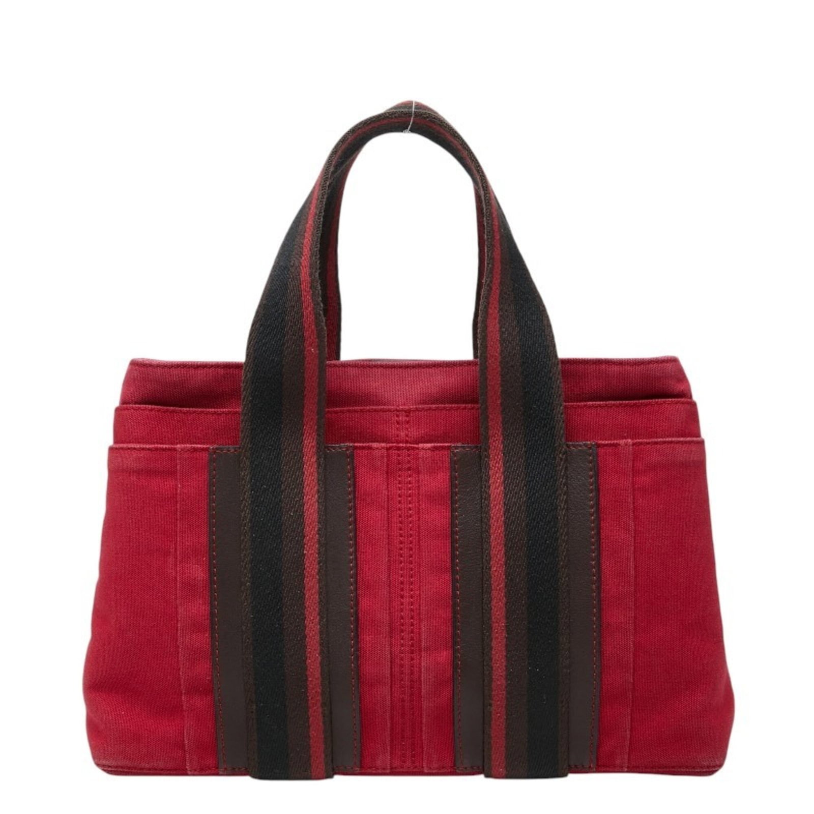 Hermes Canvas Leather Handbag Tote: Hermes Canvas Leather Handbag Tote Canvas and leather come together in this classic tote bag from Hermes, with a timeless brown and red color combination. The bag's compact size makes it easy to