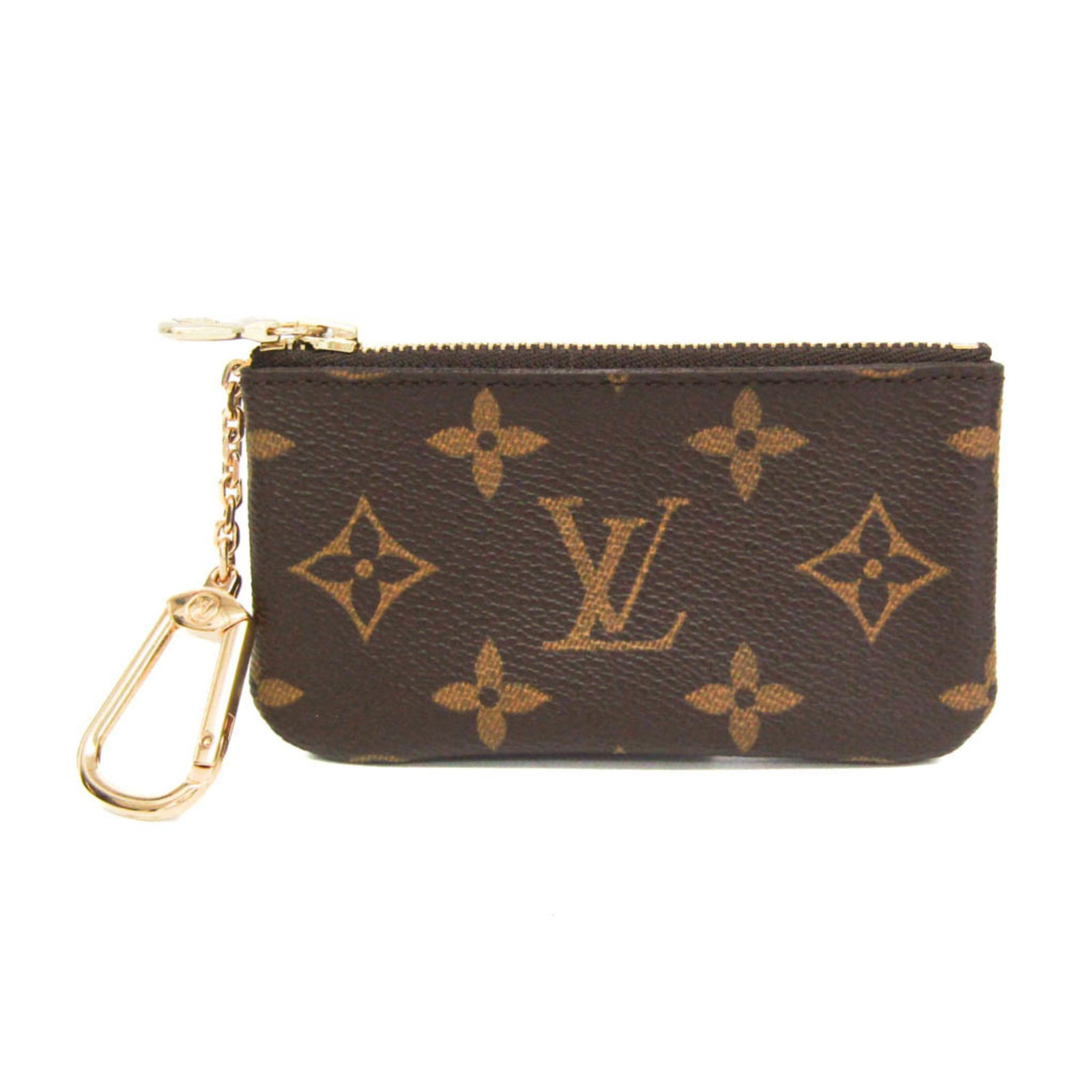Coin purse Monogram Louis Vuitton: Coin purse Monogram Louis Vuitton Monogrammed coin purse from Louis Vuitton, featuring the iconic brown monogram pattern. This key case measures 6.5cm x 12cm and is adorned with a 9cm chain strap.