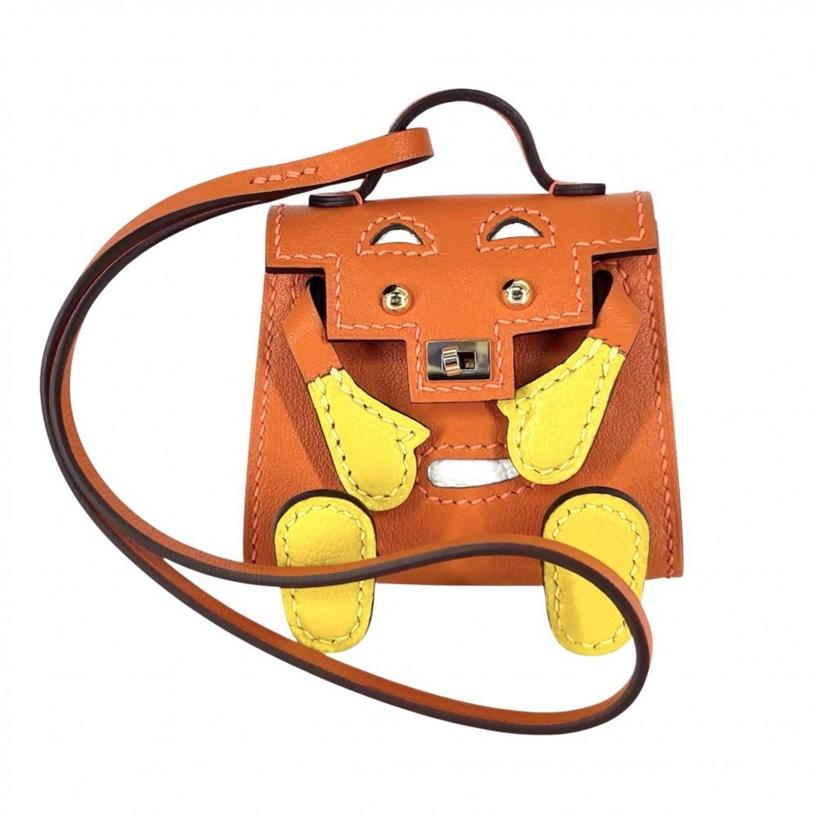 Hermes Leather Keyring: Hermes Leather Keyring The Hermes Leather Keyring boasts a vibrant orange and yellow color combination, showcasing the brand's signature style. Made from high-quality leather, this keyring measures 5.