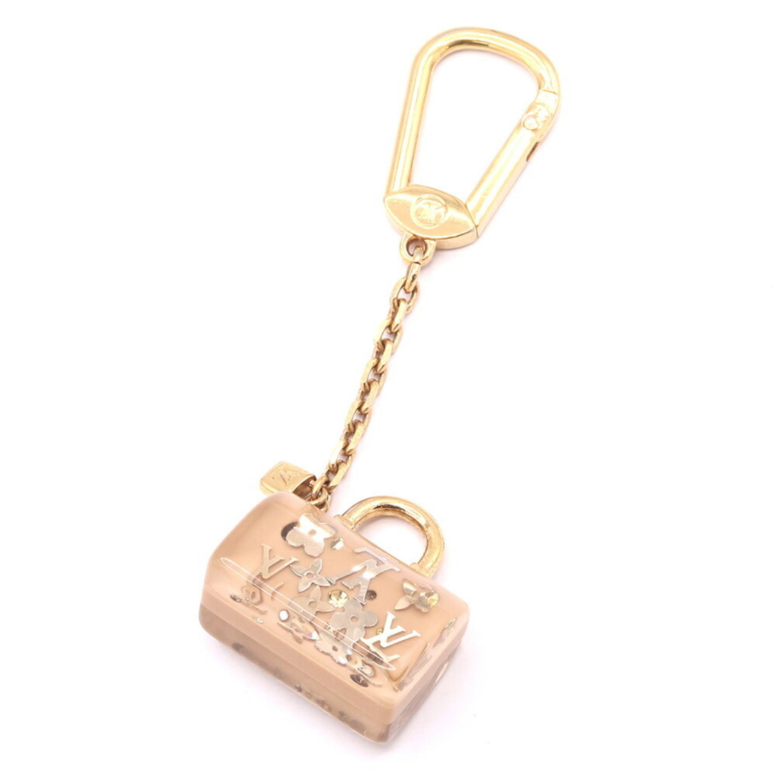 Louis Vuitton Metal Resin Keyring: Louis Vuitton Metal Resin Keyring Metal Resin Keyring by Louis Vuitton features a classic design with a subtle beige and gold color combination. Made from durable metal and resin, this keyring is both