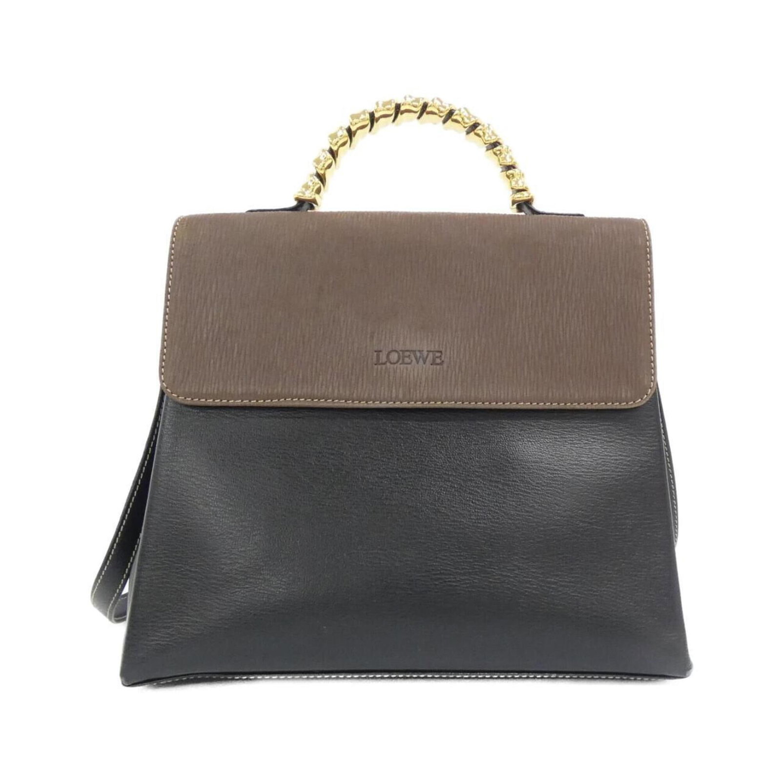 Handbag Leather Handbag: Handbag Leather Handbag Black and Brown Leather Handbag with Gold Hardware. This 22cm x 26cm x 10cm handbag features high-quality leather and gold hardware, making it a stylish and elegant accessory. 