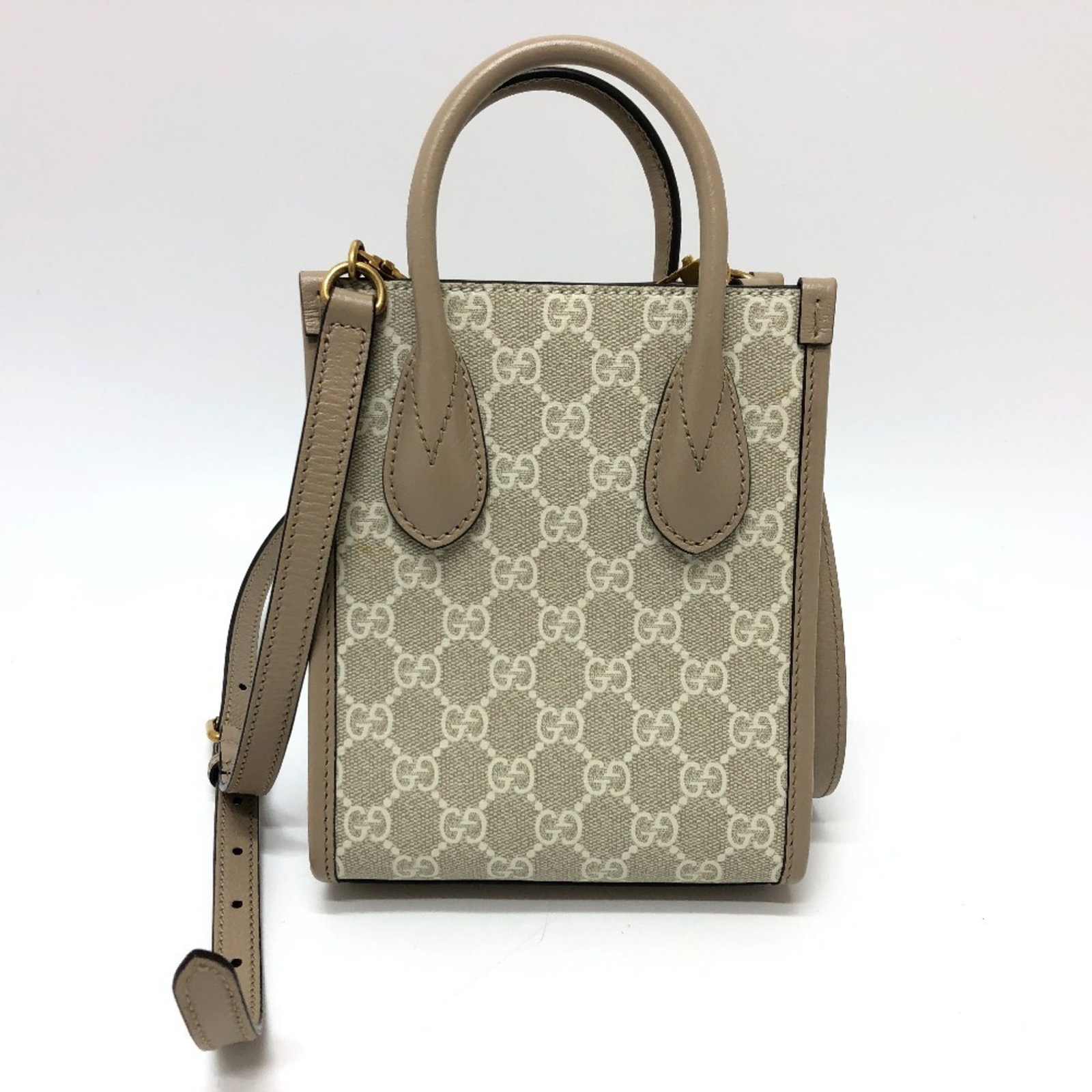 Gucci Shoulder Bag Tote Bag Gg Supreme: Gucci Shoulder Bag Tote Bag Gg Supreme Gucci's GG Supreme shoulder bag tote is a stylish and versatile accessory, featuring the iconic GG Supreme logo on its light beige material. With its compact siz