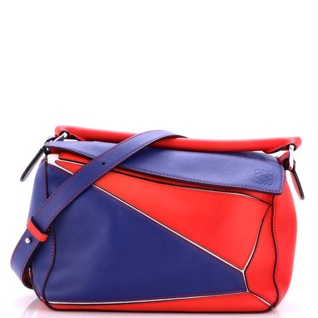 Small Leather Puzzle Bag Loewe: Small Leather Puzzle Bag Loewe Small Leather Puzzle Bag Loewe is a stylish satchel with a bold exterior color, available in both blue and red. The bag features a classic design with a leather exterior