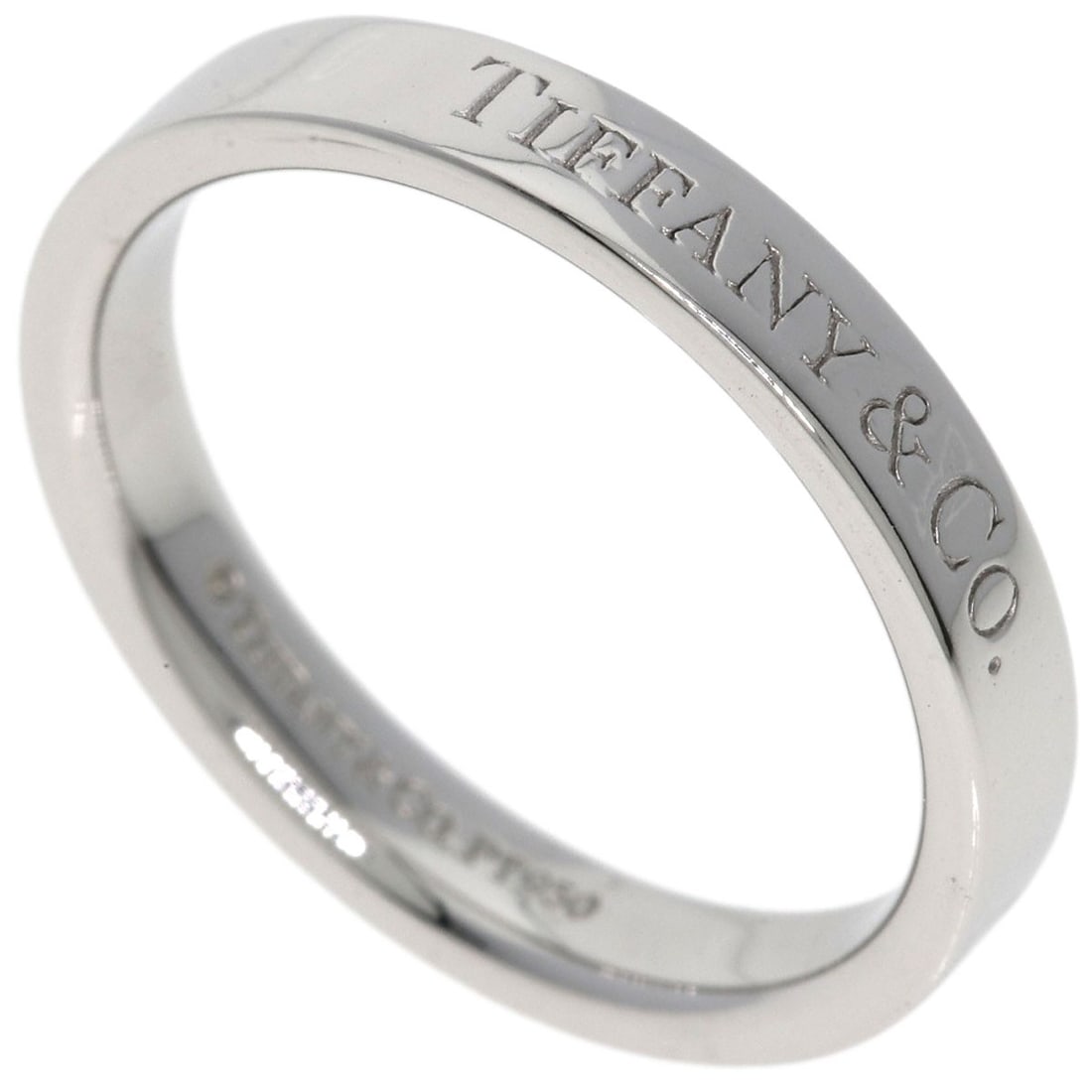 Flat Band Ring Platinum Pt950 by Tiffany&Co: Flat Band Ring Platinum Pt950 by Tiffany&Co Platinum Pt950 by Tiffany&Co, a sleek and modern flat band ring in silver-toned platinum, features a polished finish. This stylish ring is available in size