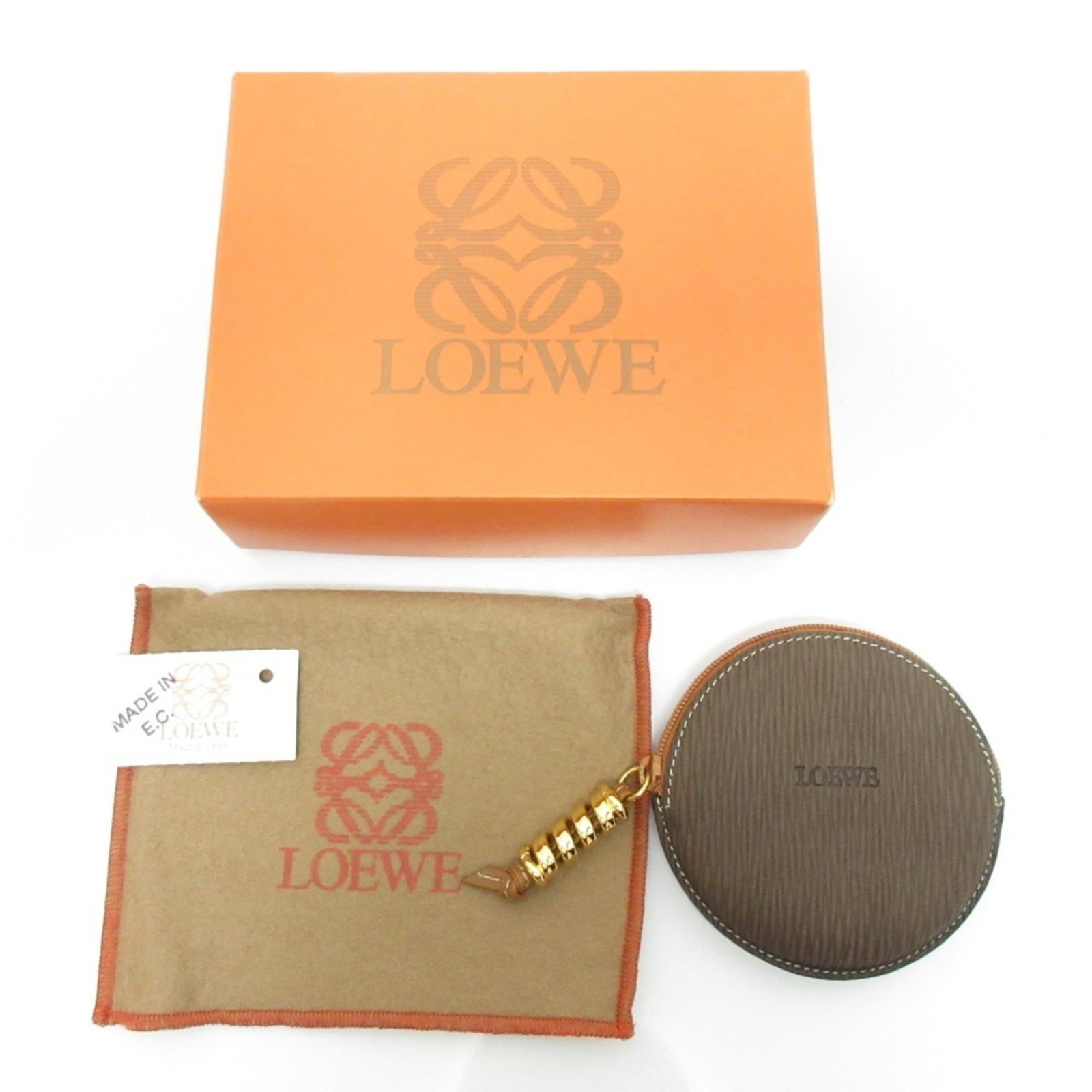 Loewe Coin Purse/ Coin Case Leather: Loewe Coin Purse/ Coin Case Leather Brown Loewe Coin Purse/ Coin Case Leather, 9cm x 9cm / 3.54'' x 3.54'', bears a signature. Made from high-quality leather, this compact coin purse features a classi