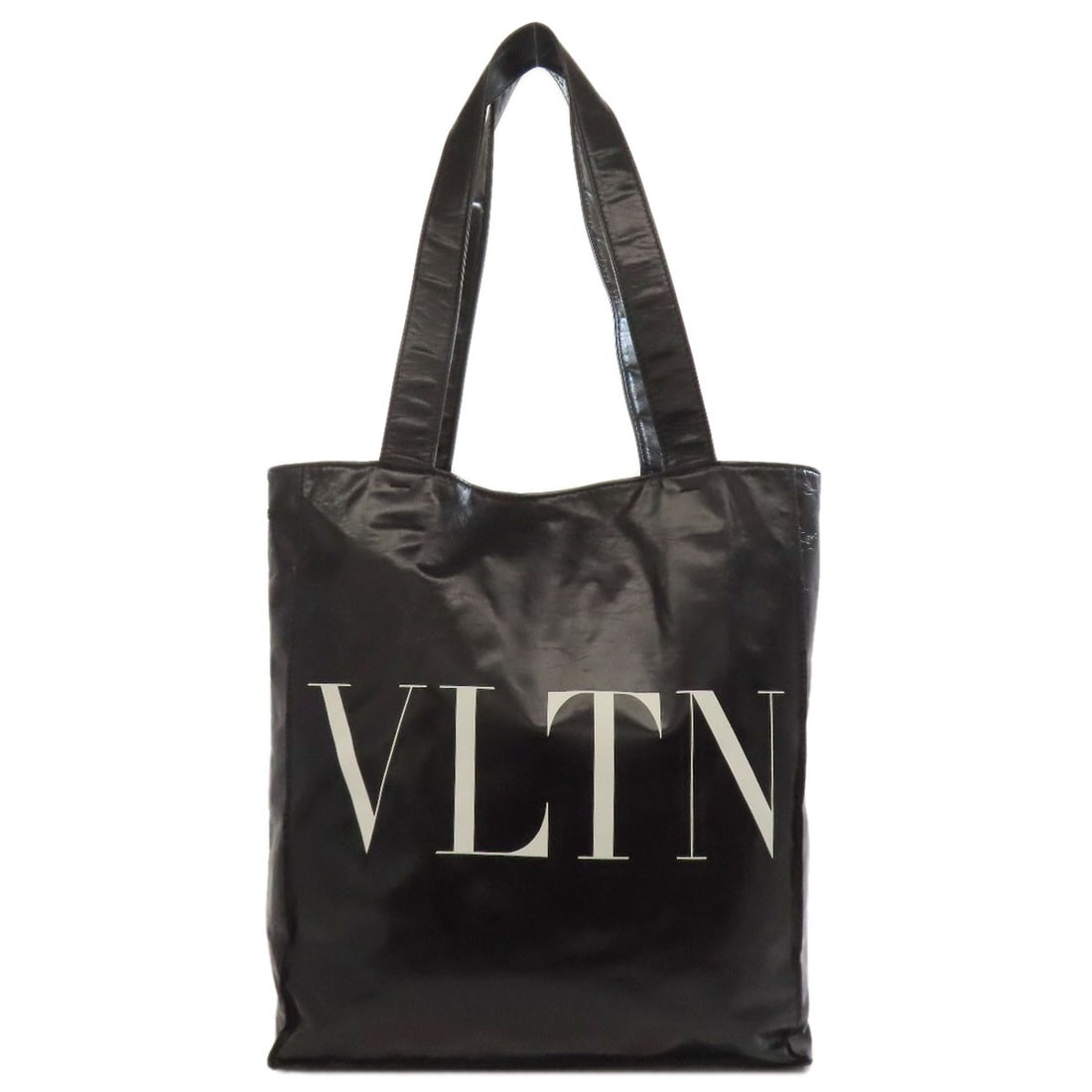 Calf Valentino Bag Tote Logo: Calf Valentino Bag Tote Logo Black calf Valentino bag tote with a prominent logo. Made from high-quality calf material, this tote features a sleek and sophisticated design. A stylish and versatile