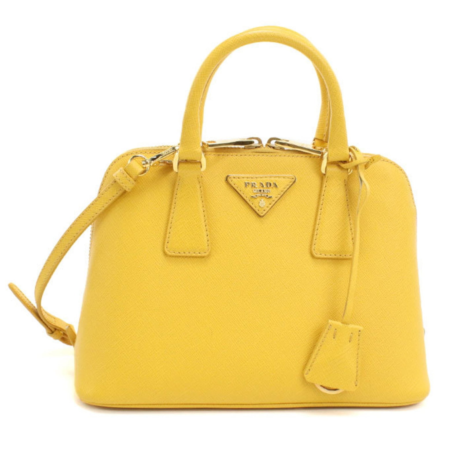 Handbag Leather Prada: Handbag Leather Prada Yellow Prada leather handbag from Italy, measuring 17.5cm x 25cm x 11cm, features gold hardware and a classic design. This stylish bag is made from high-quality leather and