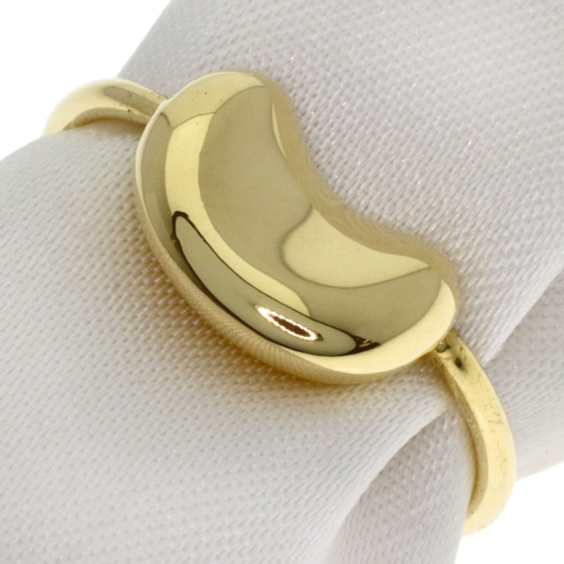 K18 Yellow Gold Tiffany&Co Bean Ring: K18 Yellow Gold Tiffany&Co Bean Ring K18 Yellow Gold Tiffany&Co Bean Ring is a 5(US) ring made of 18K Yellow Gold, featuring no stone. The ring's exterior is a beautiful gold color. Item Specifics: Br