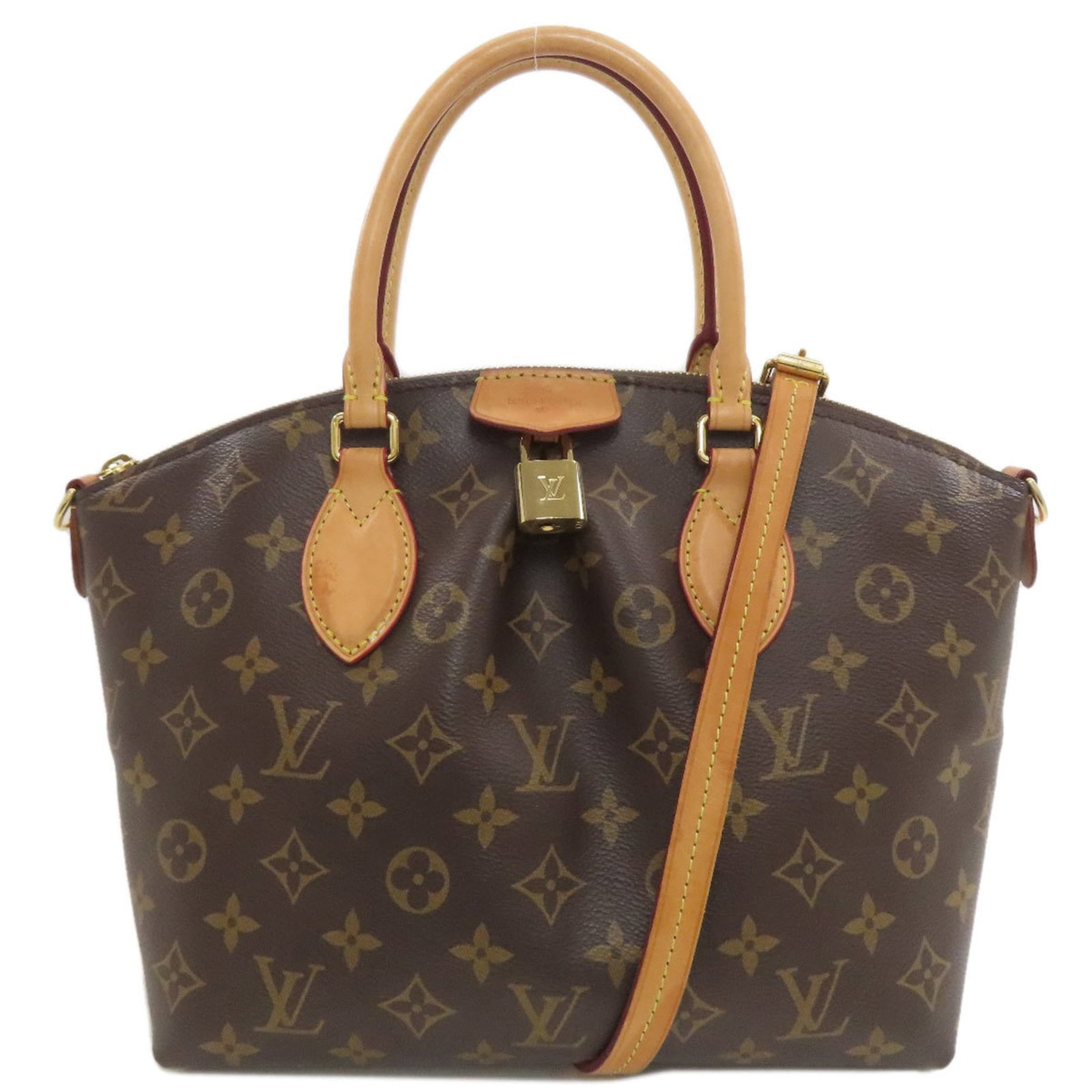 Louis Vuitton Monogram Handbag: Louis Vuitton Monogram Handbag Monogram pattern adorns this Louis Vuitton handbag, adding a touch of classic elegance to any outfit. The bag's open outer pocket provides a convenient space for