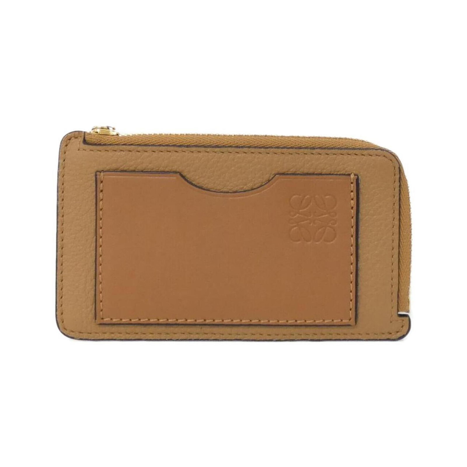 Loewe Coin Purse/ Coin Case Leather: Loewe Coin Purse/ Coin Case Leather Calfskin leather construction provides a durable and long-lasting finish. The compact size of 8cm x 13cm makes it a convenient accessory for everyday use. A signatu