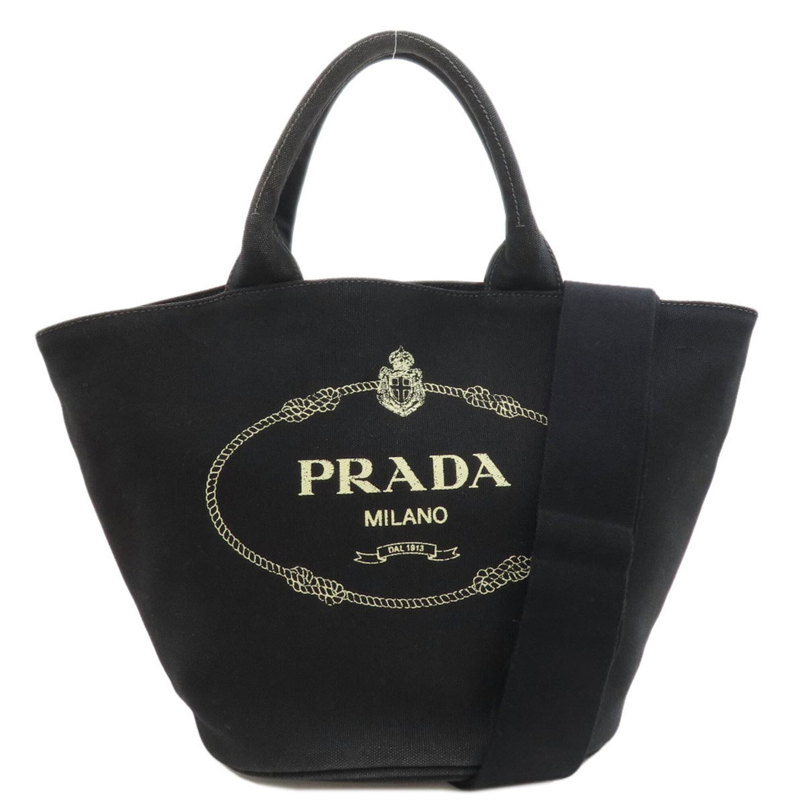 Handbag Canvas by Prada: Handbag Canvas by Prada Canvas by Prada is a sleek and sophisticated handbag made from high-quality canvas material. Measuring 26cm x 41cm x 17cm, it features a classic design with a 32cm handle and a