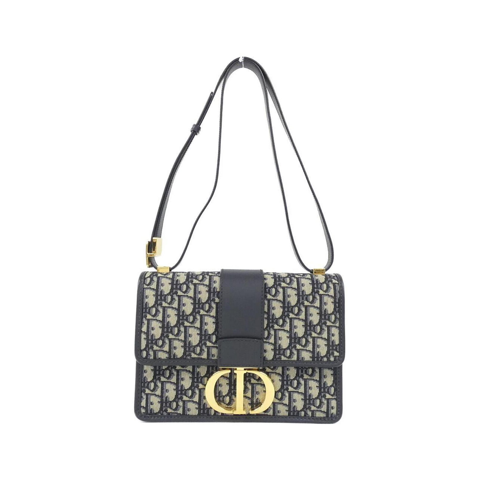 Shoulder Bag Dior Christian: Shoulder Bag Dior Christian The Dior Christian shoulder bag boasts a striking blue canvas exterior, complemented by gold hardware accents. Measuring 17cm x 24cm x 6cm, this stylish bag is a compact