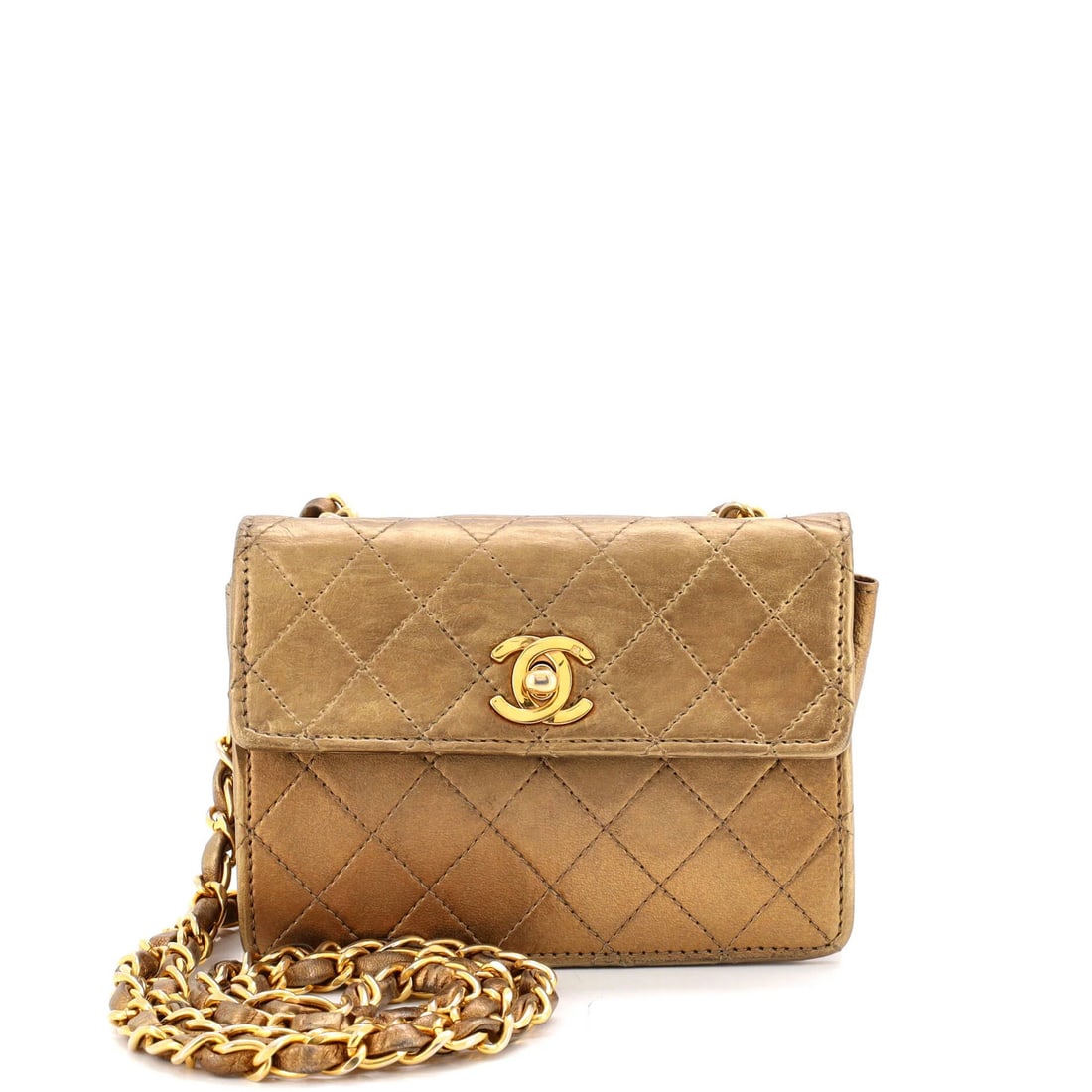 Vintage CC Chain Bag Leather Quilted Mini Extra Chanel: Vintage CC Chain Bag Leather Quilted Mini Extra Chanel The CC Chain Bag is a quintessential Chanel design, featuring a quilted leather exterior in gold and a chain flap closure. Measuring 4" tall and