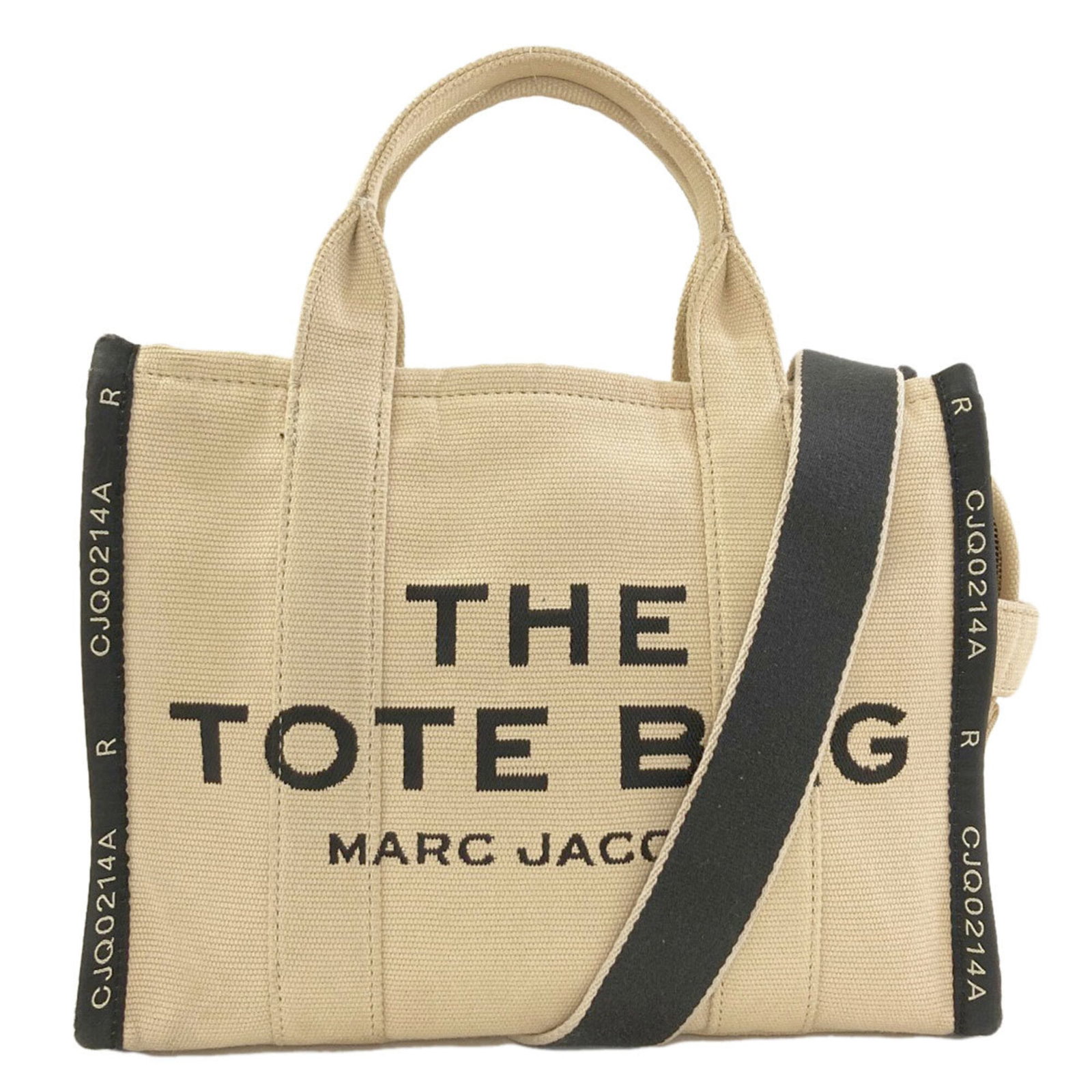 Canvas Handbag Tote Jacobs Marc: Canvas Handbag Tote Jacobs Marc Canvas Handbag Tote Jacobs Marc - A stylish and versatile tote bag made from high-quality canvas, featuring a sleek beige and black design. Measuring 26cm x 32cm x 15cm