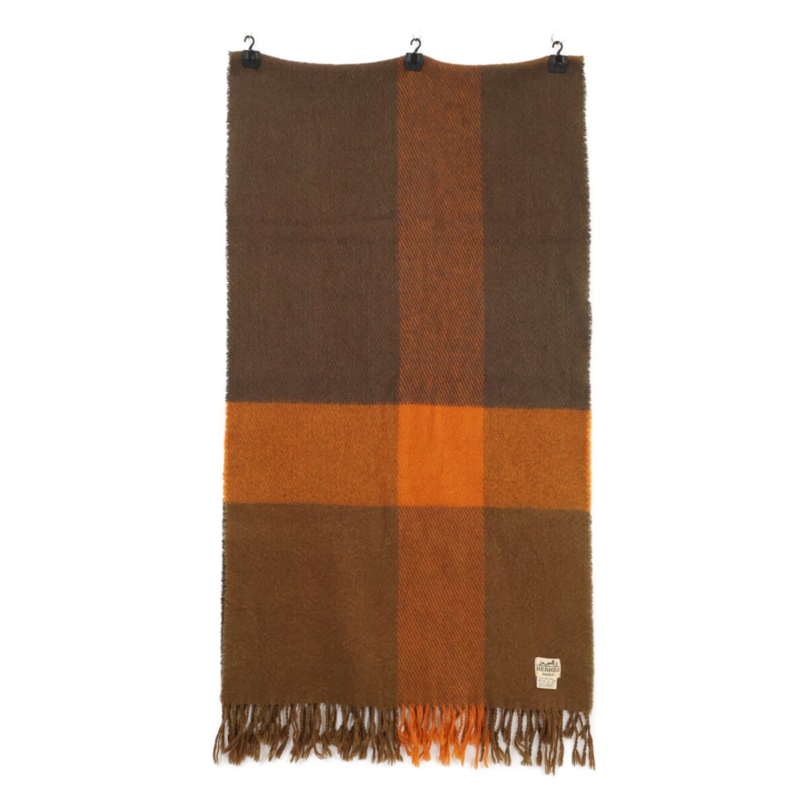 Hermes stole wool: Hermes stole wool Brown and orange hues of the Hermes stole wool create a striking contrast, with the natural fibers of the wool adding warmth and texture to the overall design. Measuring 2.36m x