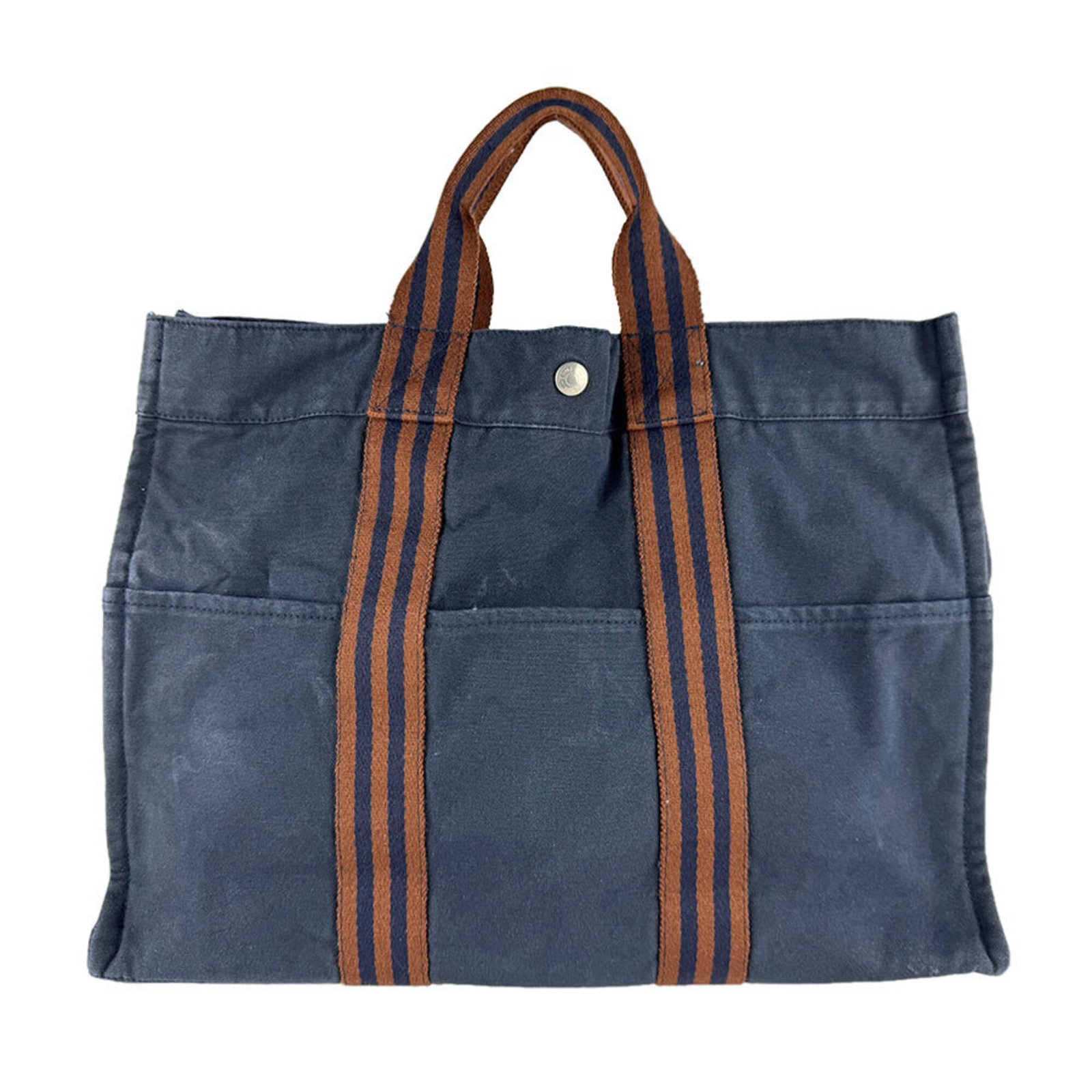 Handbag Canvas: Handbag Canvas Canvas from a renowned French brand, featuring a classic brown and navy color combination, is a timeless and versatile accessory. Measuring 31cm x 42cm x 10cm, this canvas handbag is a