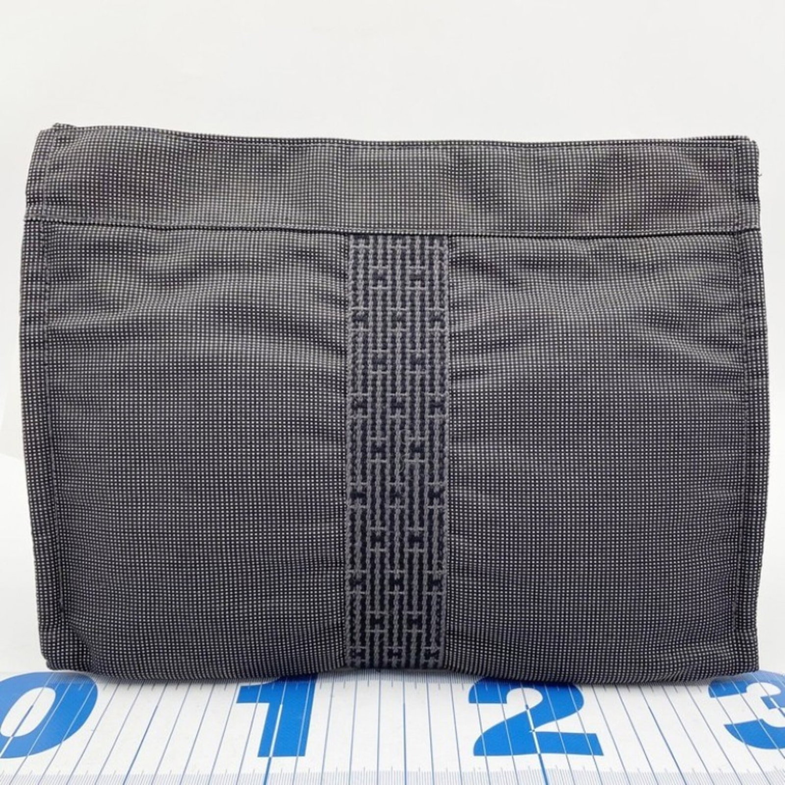 Canvas Handbag Bag Hermes: Canvas Handbag Bag Hermes Canvas Handbag Bag by Hermes, a stylish and versatile clutch, features a timeless gray canvas design, measuring 22cm x 31cm x 11cm. This compact handbag is perfect for