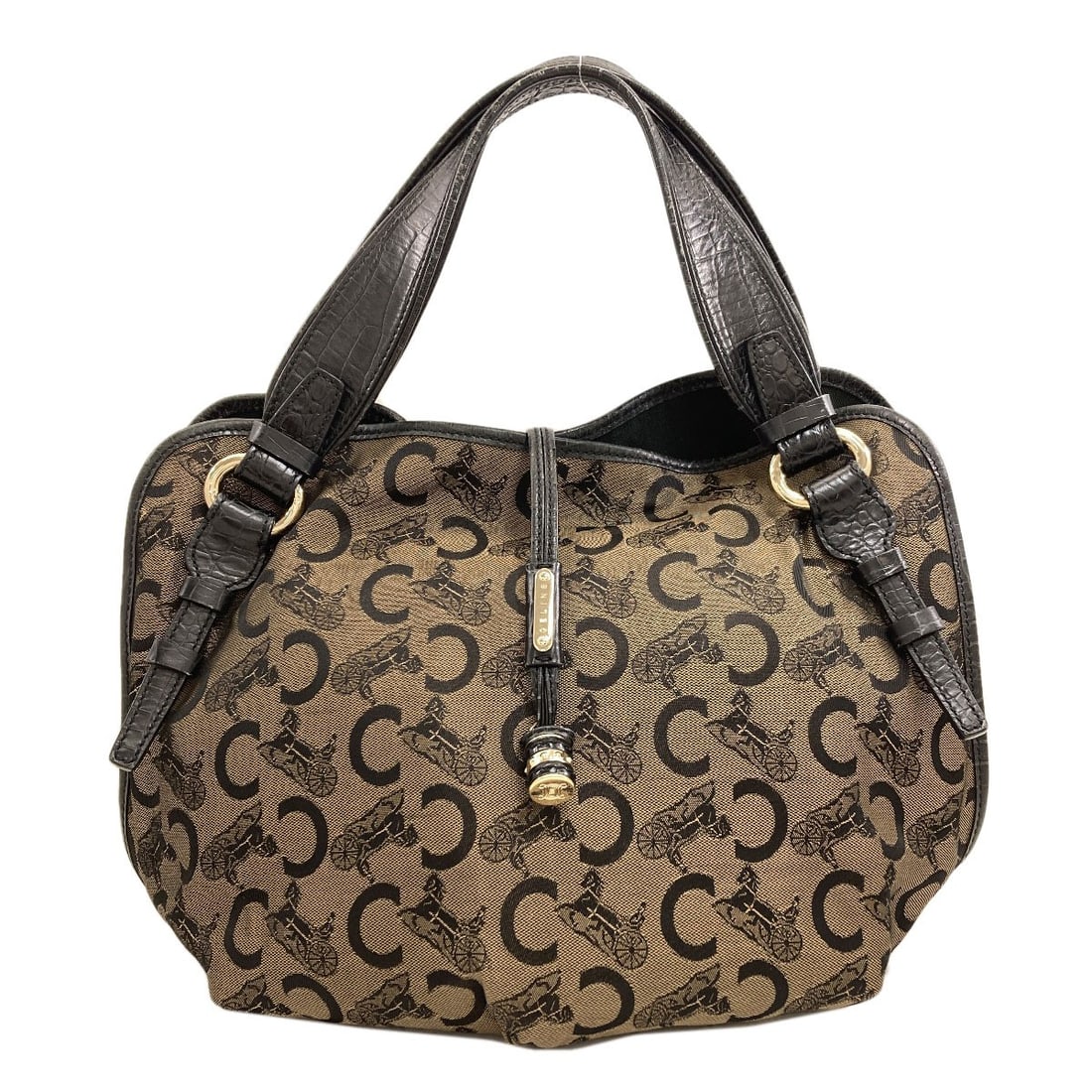 Saluki Handbag Canvas Celine: Saluki Handbag Canvas Celine Brown canvas Celine handbag with a classic style. This canvas Celine handbag features a timeless design and a brown exterior color. The bag's canvas material provides a