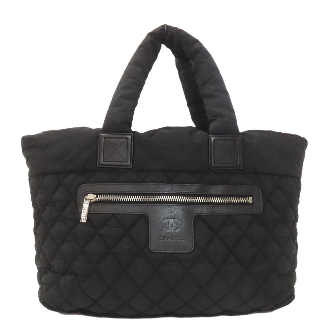 Cocoko Koon Chanel Nylon Tote Bag Silverhardware: Cocoko Koon Chanel Nylon Tote Bag Silverhardware Black Chanel Nylon Tote Bag with Silver Hardware. This black tote bag features a nylon exterior and silver hardware, bearing the iconic Chanel style.