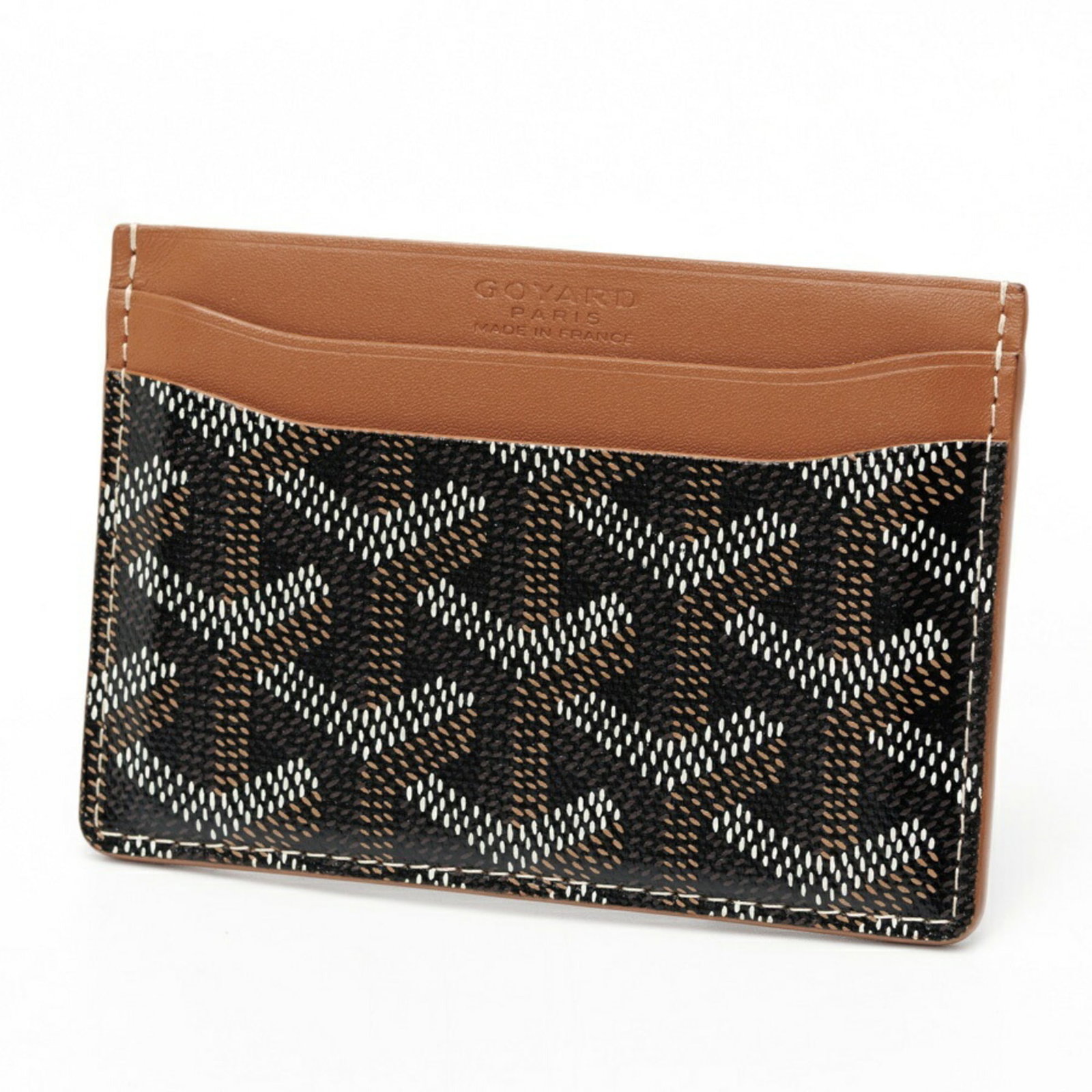 Canvas Leather Goyard Card Case: Canvas Leather Goyard Card Case Canvas Leather Goyard Card Case is made from canvas and leather, with a signature and a black color option. The case measures 7cm x 10.5cm x 3mm and has a classic desig