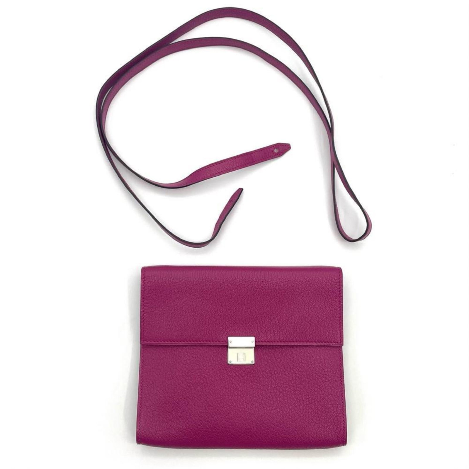 Chevre Leather Hermes Bag: Chevre Leather Hermes Bag Chevre leather gives this Hermes bag a unique, soft touch. The rose purple color adds a touch of elegance, while the compact size makes it perfect for everyday carry. With